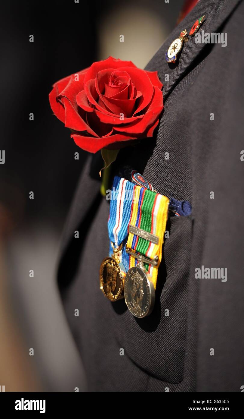 A red rose is pinned the the jacket of a Korean War veteran in St Peter