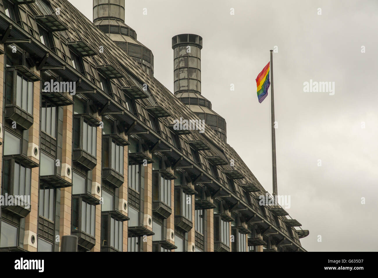 Parliament building Portcullis House in London flying the Rainbow flag to celebrate Pride week 2016 from June 10-26 Stock Photo