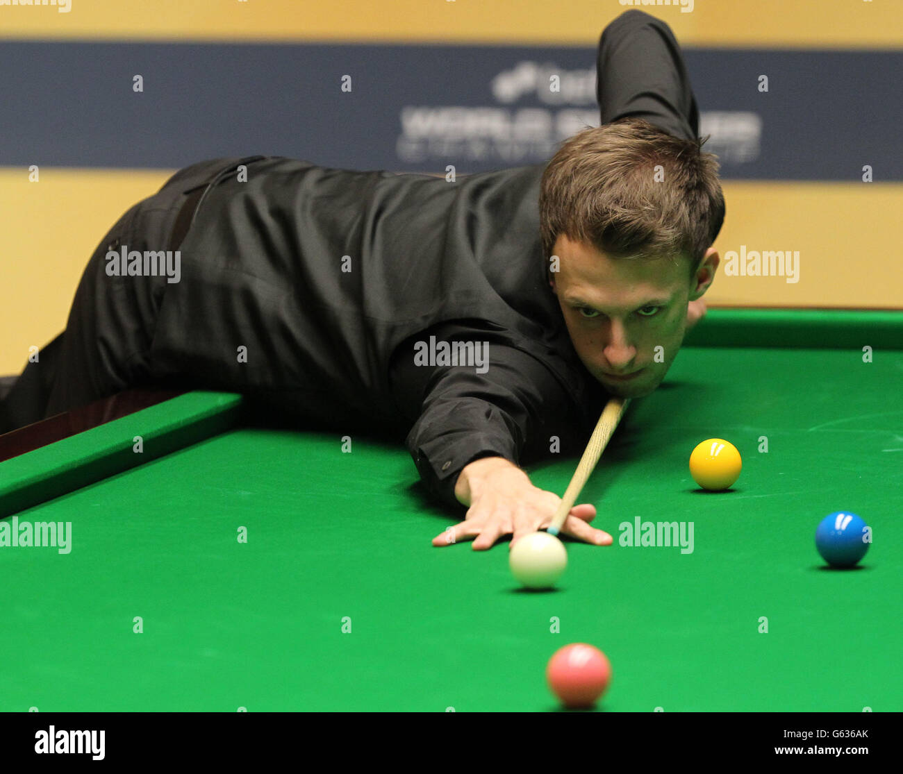 England's Judd Trump at the table in the first round against Wales's Dominic Dale during the Betfair World Championships at the Crucible, Sheffield. Stock Photo