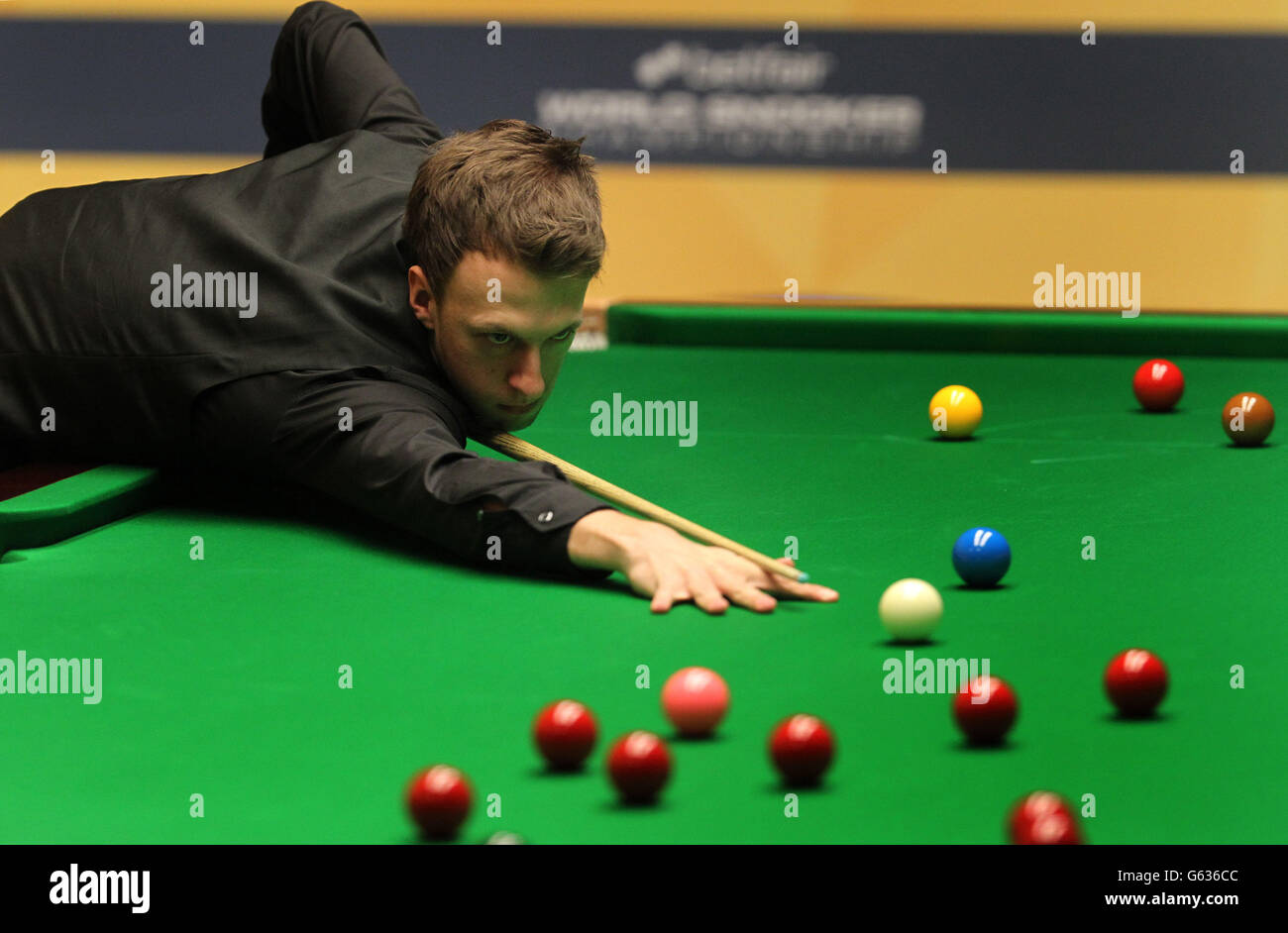 England's Judd Trump at the table in the first round against Wales's Dominic Dale during the Betfair World Championships at the Crucible, Sheffield. Stock Photo