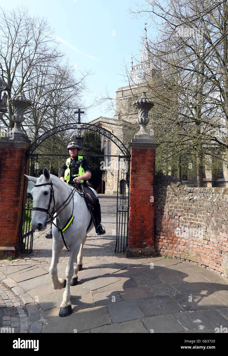 Police horses at St Mary the Virgin church in Aylesbury, Buckinghamshire, where a man found a human ear was found yesterday while walking his dog in the graveyard. Stock Photo