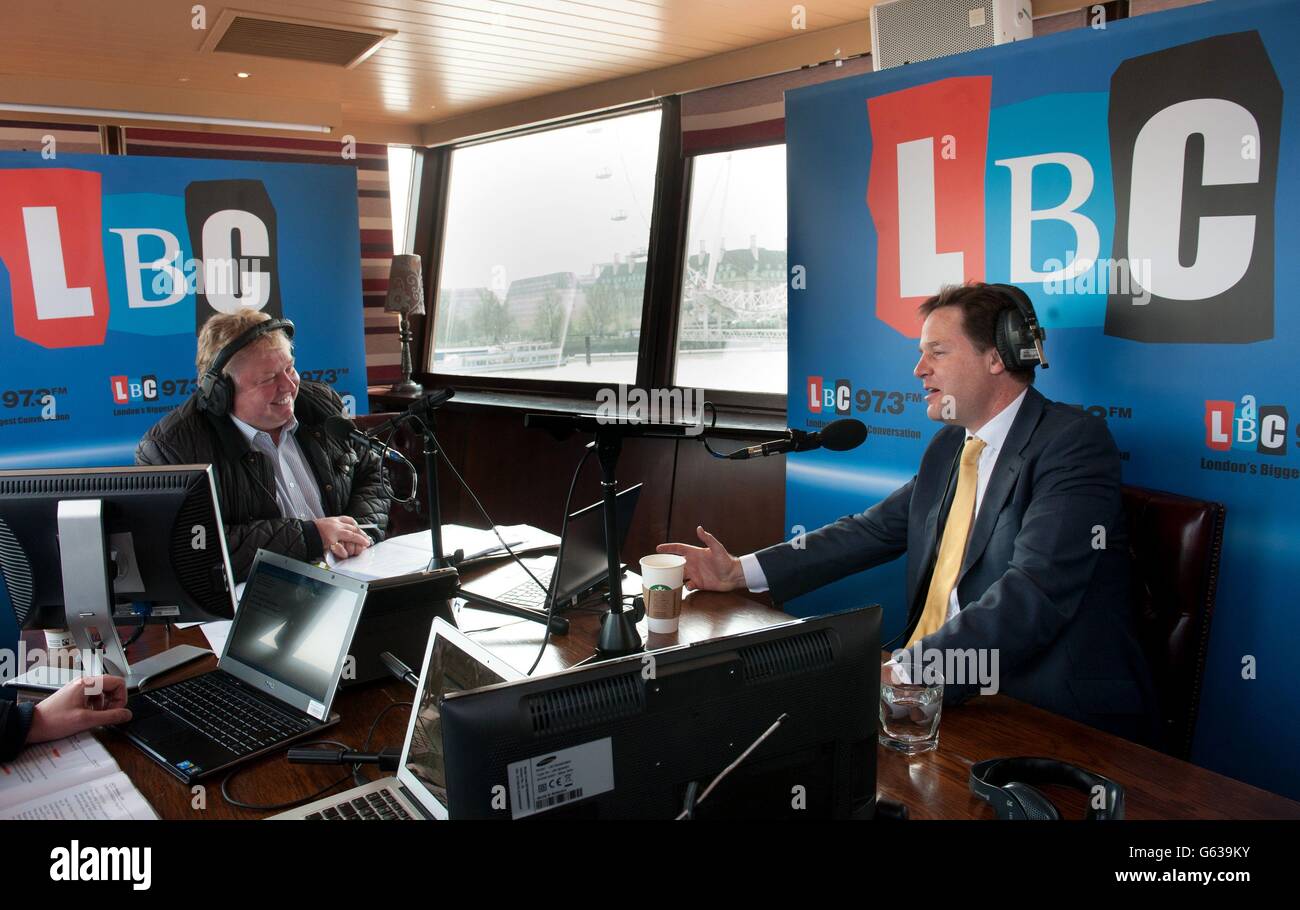 Deputy Prime Minister Nick Clegg co-hosts his weekly phone in radio show with LBC's Nick Ferrari (left) on the moored boat the Tattersall Castle on the River Thames in London, where he was questioned by voters. Stock Photo