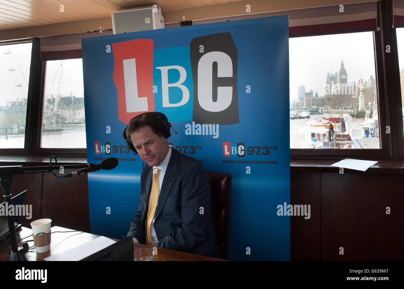 Deputy Prime Minister Nick Clegg co-hosts his weekly phone in radio show with LBC's Nick Ferrari (not pictured) on the moored boat the Tattersall Castle on the River Thames in London, where he was questioned by voters. Stock Photo