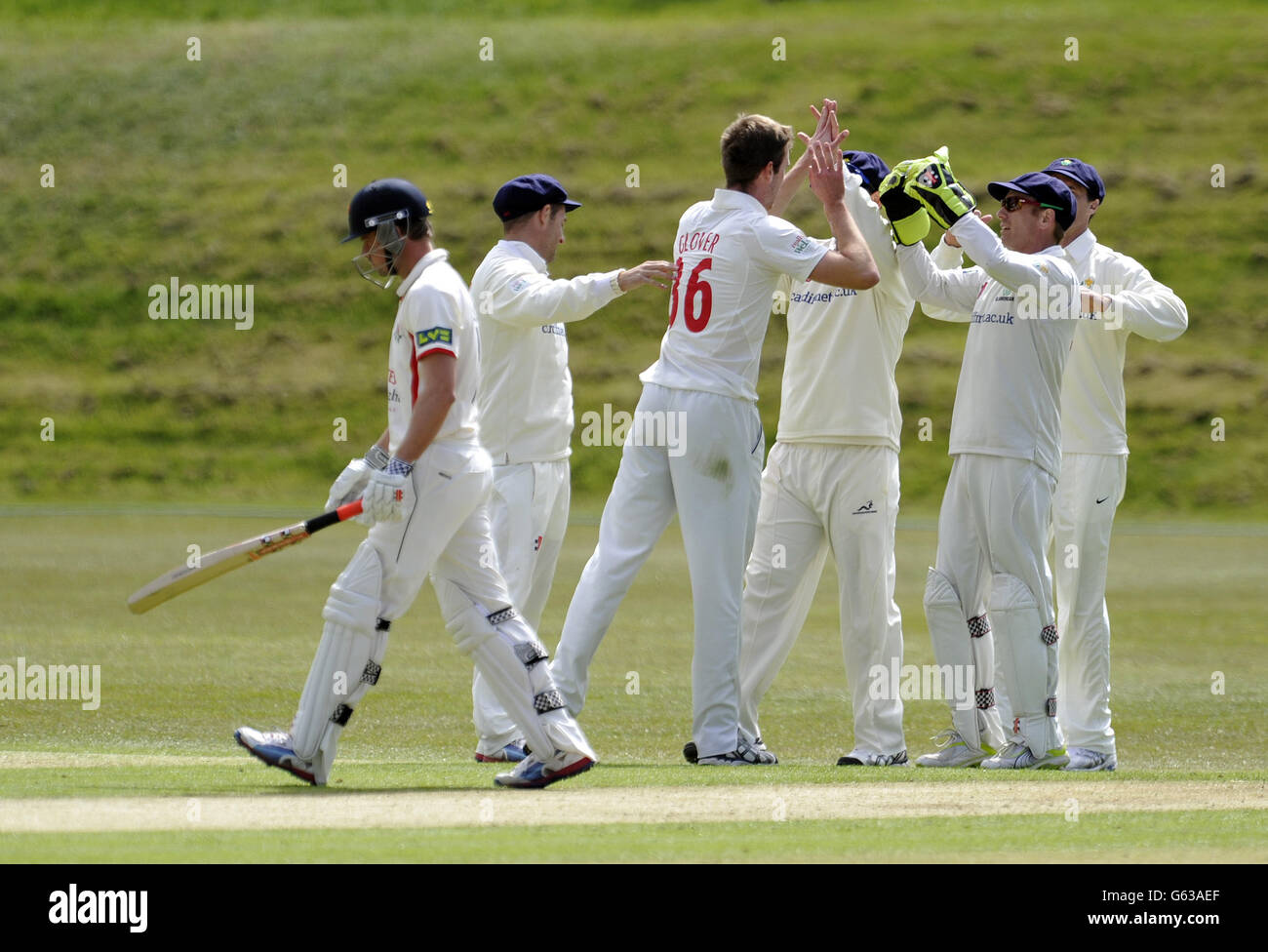Glamorgan's John Glover (third left) celebrates with his team-mates after taking the wicket of Gareth Cross (left) during the LV County Chamionship, Division Two match at the Colwyn Bay Cricket Club, Colwyn Bay. Stock Photo