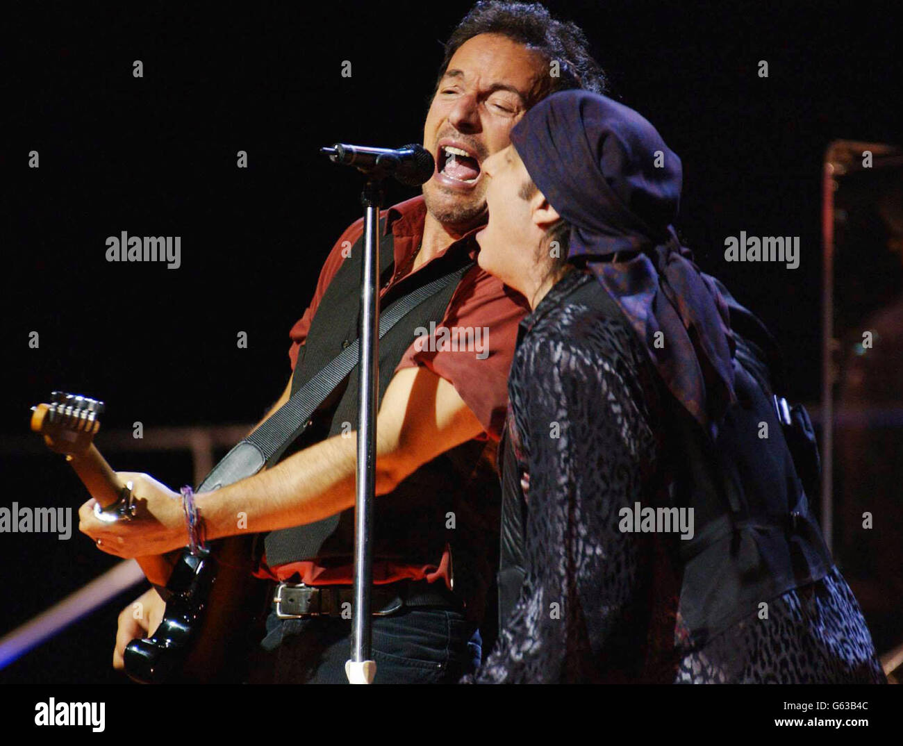 American rock star Bruce Springsteen (left) performing on stage with Little Steven (Steven Van Zandt) during a one-off London concert at Wembley Arena as part of his world tour following the release of his first album for eight years 'The Rising'. Stock Photo