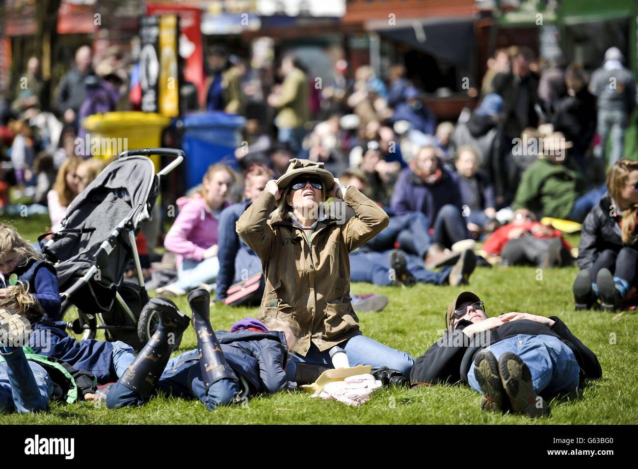 Crowds watch the dressage action on the big screen in sunny weather during day three of the Badminton Horse Trials in Badminton, Gloucestershire. Stock Photo