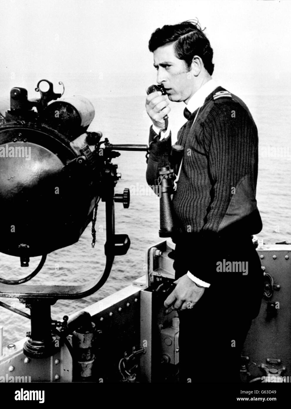 The Prince of Wales, issuing orders aboard his ship, HMS Bronington, the coastal minesweeper off the coast of Scotland, November 1, 1976. * The Prince of Wales today met Kevin Boyle, 41, who worked alongside him on HMS Bronington, during a visit to The Big House, a second-stage house for the homeless in south London, Friday October 11, 2002. Boyle is a resident of The Big House after falling on hard times. Stock Photo