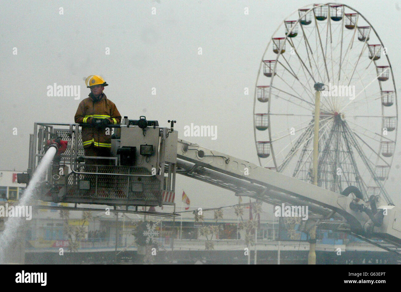 Fire Fighers in Blackpool bring a blaze at an amusements arcade under control, after thirty people were evacuated from their homes. Firefighters forced their way into the the Grab City complex, which includes a Madame Tussaud's wax museum. * ... on Blackpool's south promenade after the blaze was discovered in the early hours of this morning. It was not yet known if the cause of the fire was suspicious police said. Stock Photo