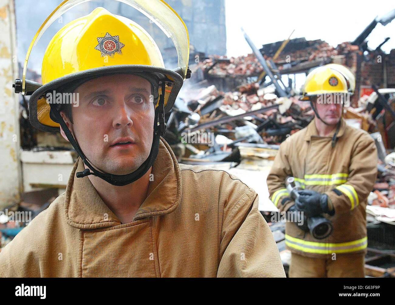 Firefighters Paul Webb (left) and Steve Rainford from Green Watch in Fleetwood damp down after a fire at an amusements arcade in Blackpool. * Thirty people were evacuated from their homes after firefighters forced their way into the the Grab City complex, which includes a Madame Tussaud's wax museum, on Blackpool's south promenade after the blaze was discovered in the early hours of this morning. It was not yet known if the cause of the fire was suspicious police said. Stock Photo