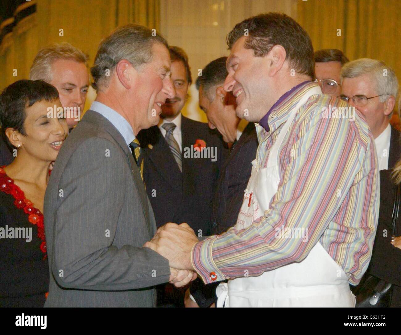 The Prince of Wales thanks Italian celebrity chef, Dario Cecchini, sampling some beef at a British beef promotion reception at the Hotel Parco dei Principi, in Rome. It was the second day of Prince Charles official cultural tour in Italy, which also takes in Naples. Stock Photo
