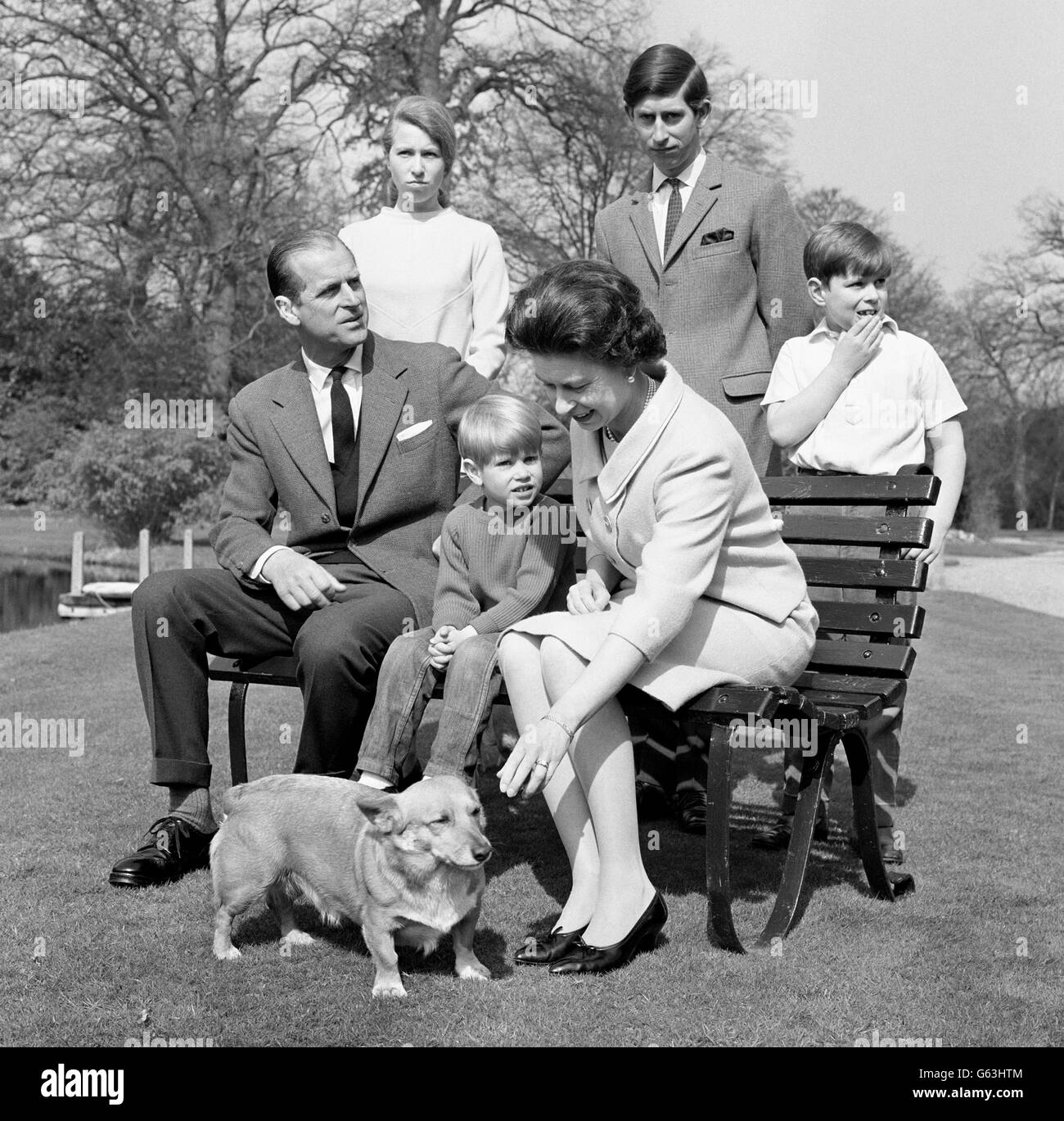 This time it is four-year-old Prince Edward and the pet Corgi who seem to be attracting the attention of Queen Elizabeth II, 42. The Royal Family were posing in the gardens at Frogmore, Windsor, for special birthday photographs. Something else seems to be attracting the attention of the Duke of Edinburgh and Prince Andrew. Also in the picture are Princess Anne (18 in August) and the Prince of Wales, 19. Stock Photo