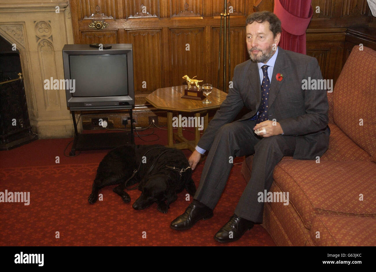 The Home Secretary David Blunkett relaxes in his office in the House of Commons, London prior to the visit of the new Assistant for Homeland Security Advisor for the United States, Governor Tom Ridge. Tom Ridge was shedding light on the US s internal security strategy. Stock Photo