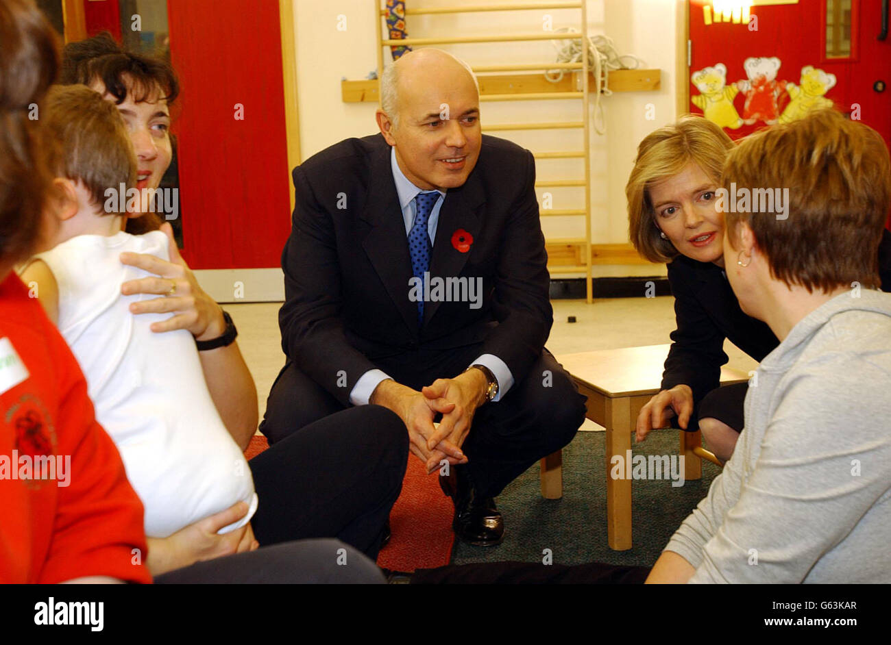 Conservative Leader Ian Duncan Smith and his wife Betsy (centre) meet 3 year old Abigail Doughty at the National Institute for Conductive Education in Cannon Hill Park. * Conservative leader Iain Duncan Smith today said his party was responding very positively to his call for it to unite or die and said party members and the public wanted to see reform of public services. Stock Photo