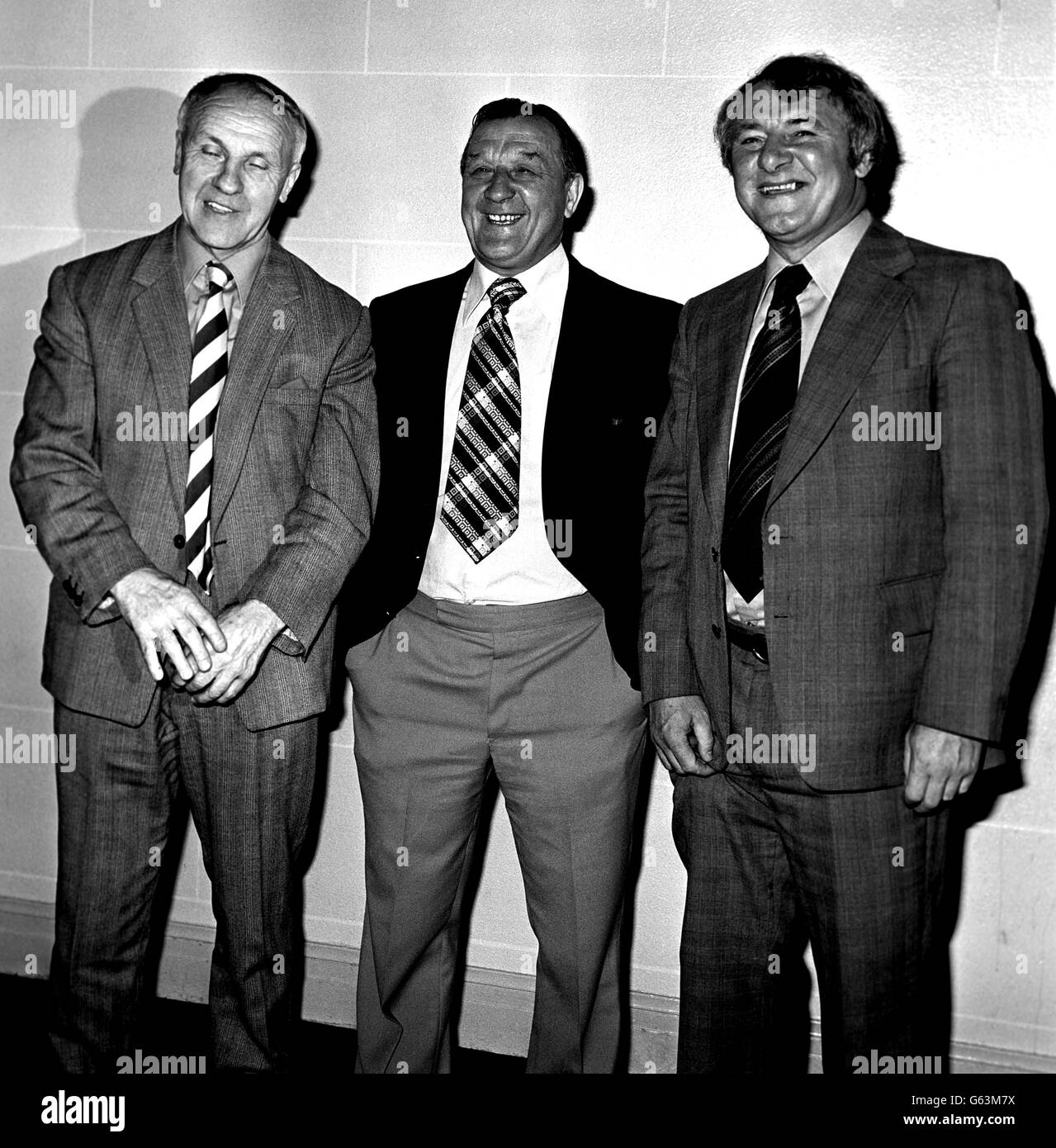 Liverpool's Bob Paisley (centre) footbal Manager of the Year for the second year running, is congratulated by former Liverpool Manager, Bill Shankly, left, and Tommy Docherty, Manager of Manchester United who beat Liverpool in the FA Cup, after presentation to Bob Paisley at Cafe Royal. Stock Photo