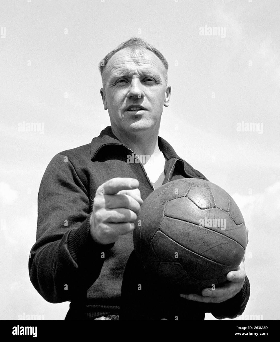 Bill Shankly has just signed the first contract of a managerial career taking in Carlisle, Workington, Grimsby, Huddersfield, and Merseyside. It is to be a three-year contract for Liverpool. Stock Photo