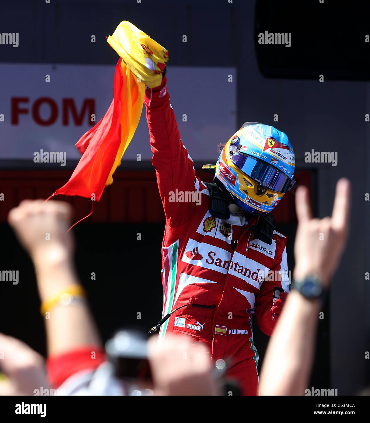 Ferrari's Fernando Alonso celebrates his victory in the Spanish Grand Prix at the Circuit de