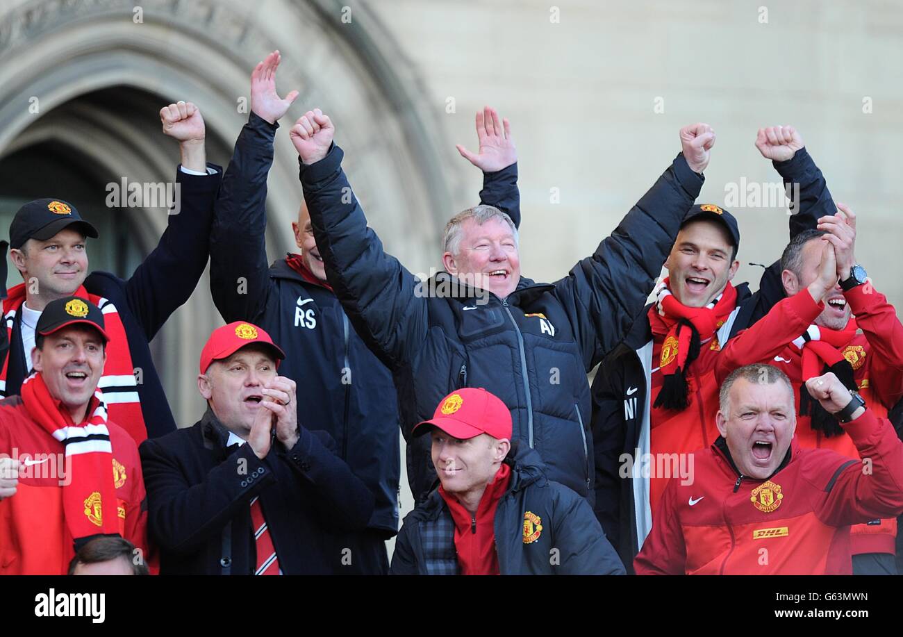 Manchester United manager Sir Alex Ferguson (centre) celebrates during the Barclays Premier League winners parade through Manchester. Stock Photo