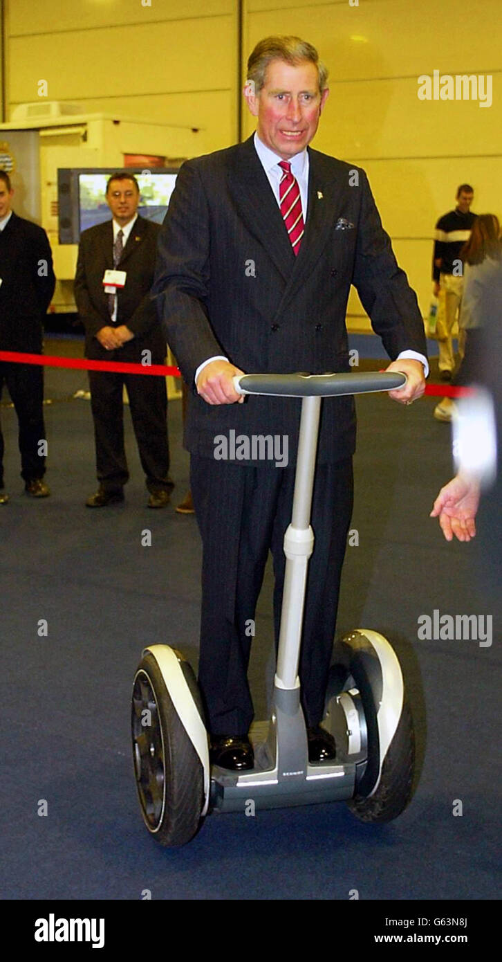 The Prince of Wales, on his 54th birthday, rides on an electrically-powered Segway during a visit to a vocational careers' fair in Salford, Greater Manchester. The invention, which looks like an electric scooter, uses a high-tech system of gyroscopes to detect the user's natural sense of balance to steer it. Stock Photo