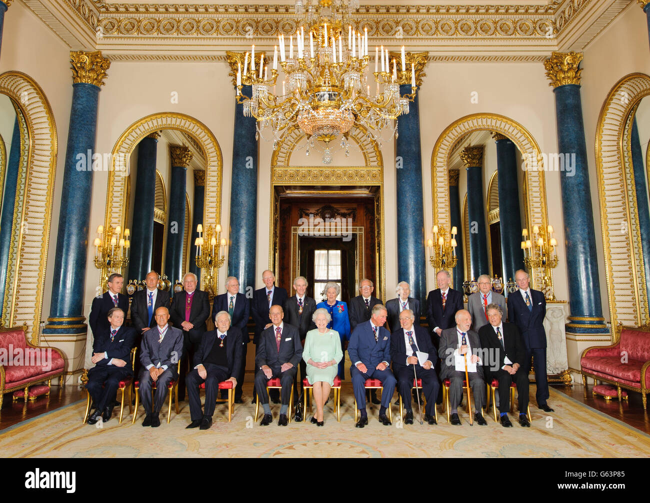 Queen Elizabeth II (front, centre) with members of the Order of Merit (front row left to right) Professor Sir Roger Penrose, Lord Foster of Thames Bank, the Revd. Professor Owen Chadwick, the Duke of Edinburgh, the Prince of Wales, Sir Michael Atiyah, Sir Anthony Caro, Sir Tom Stoppard (back row, left to right) Neil MacGregor, Sir Tim Berners-Lee, Lord Eames, Sir David Attenborough, Lord Rothschild, Lord May of Oxford, Baroness Boothroyd, Professor Sir Michael Howard, Lord Rees of Ludlow, the Right Honourable Jean Chretien, David Hockney and Lord Fellowes, in the Music Room, at Buckingham Stock Photo