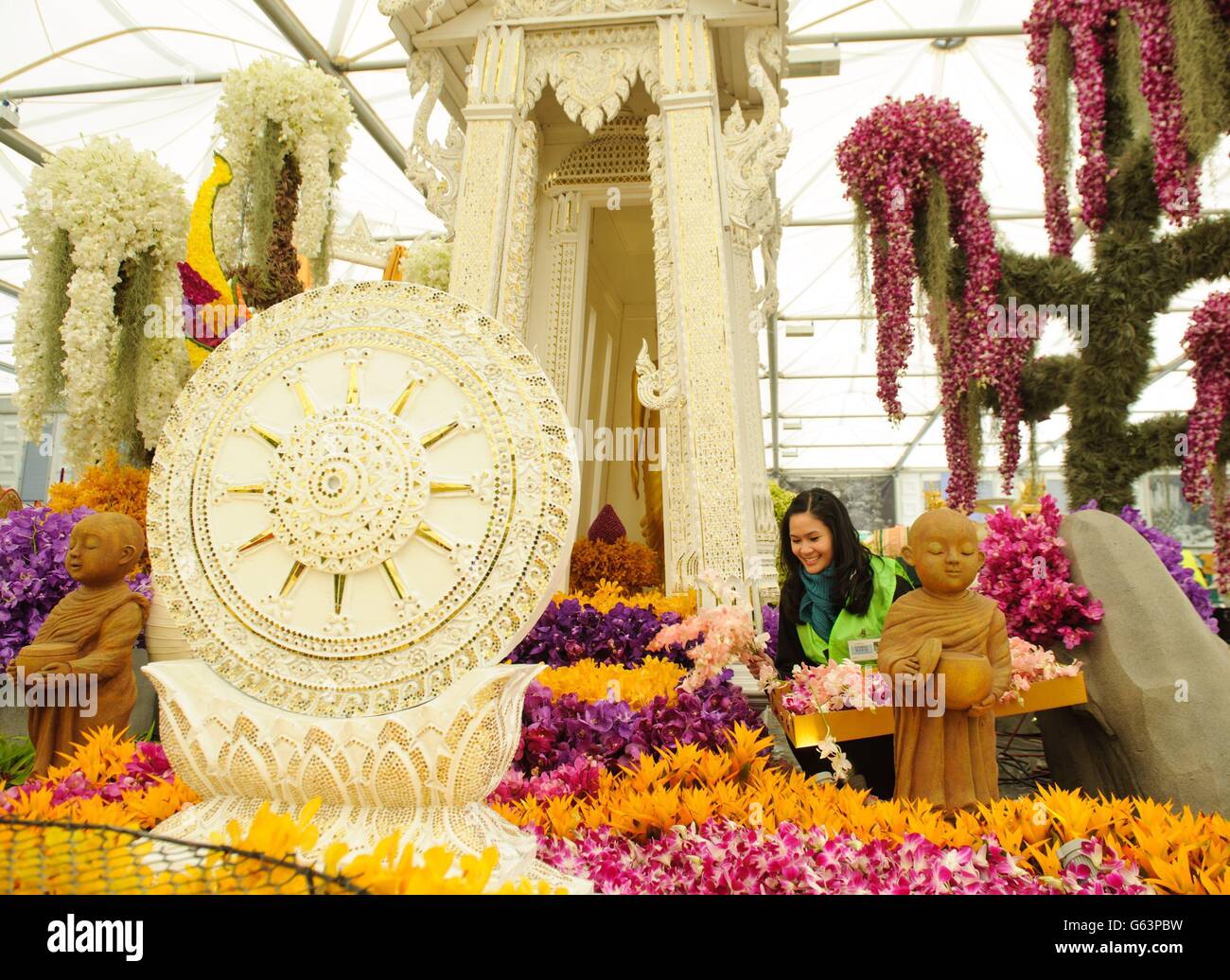 Ploypan Patrathira Nond arranges flowers in the Nong Nooch Pattaya Tropical Garden at the RHS Chelsea Flower Show, which opens to the public from May 21 to May 25 2013. Stock Photo