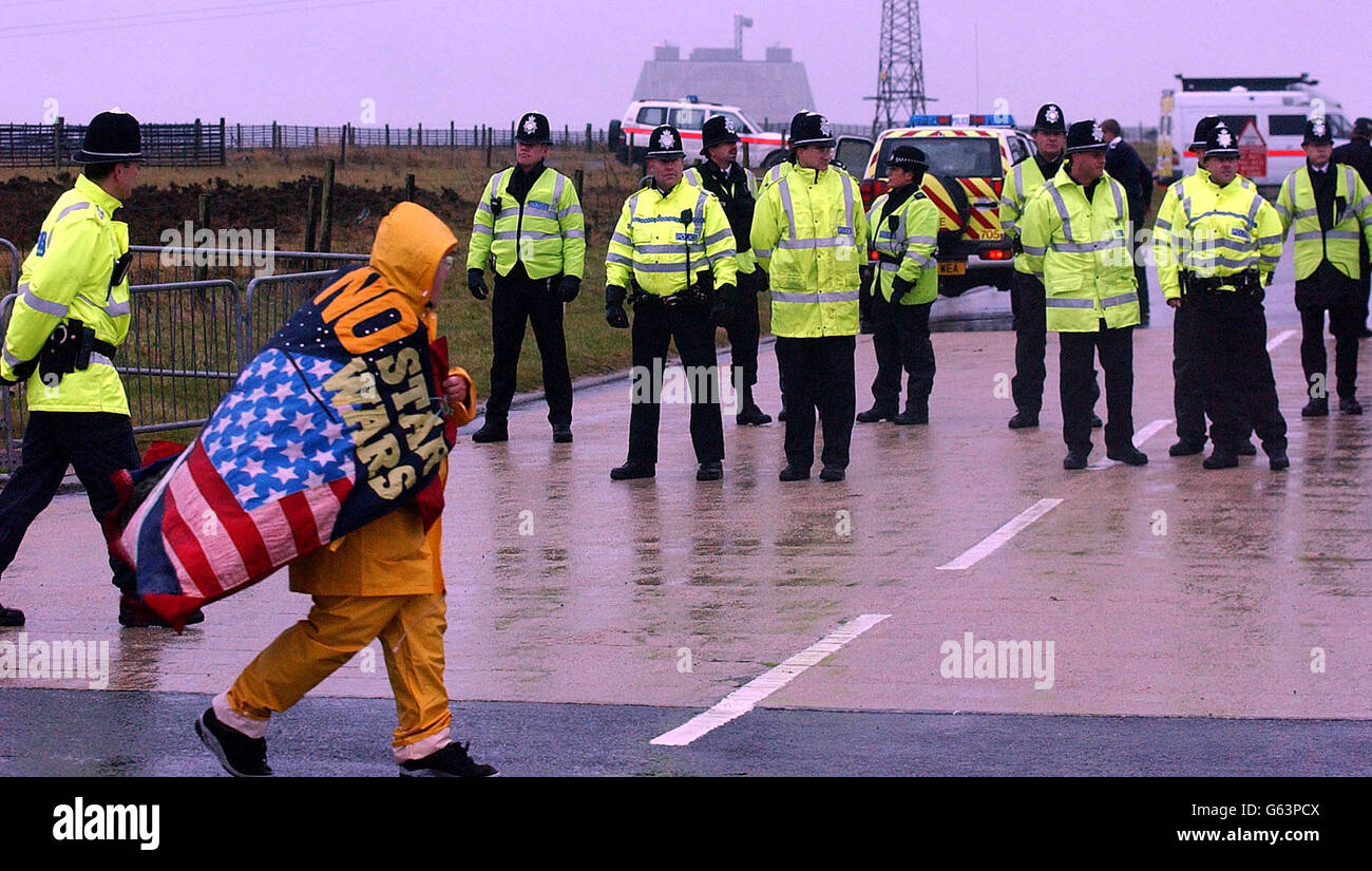 A CND protestor at the RAF Fylingdales Base on the North York Moors, where American Lt General Kadish was visiting. The protest is being held because CND campaigners think the base is being used for the controversial Star Wars program. * Despite the freezing cold conditions and torrential rain over 30 demonstrators wrapped up in waterproofs and thermals made their views clear by waving banners,props and placards. One stated: 'US Space Command, Killers, Cowards, Criminal Creeps, Hands Off Flyingdale.' Stock Photo