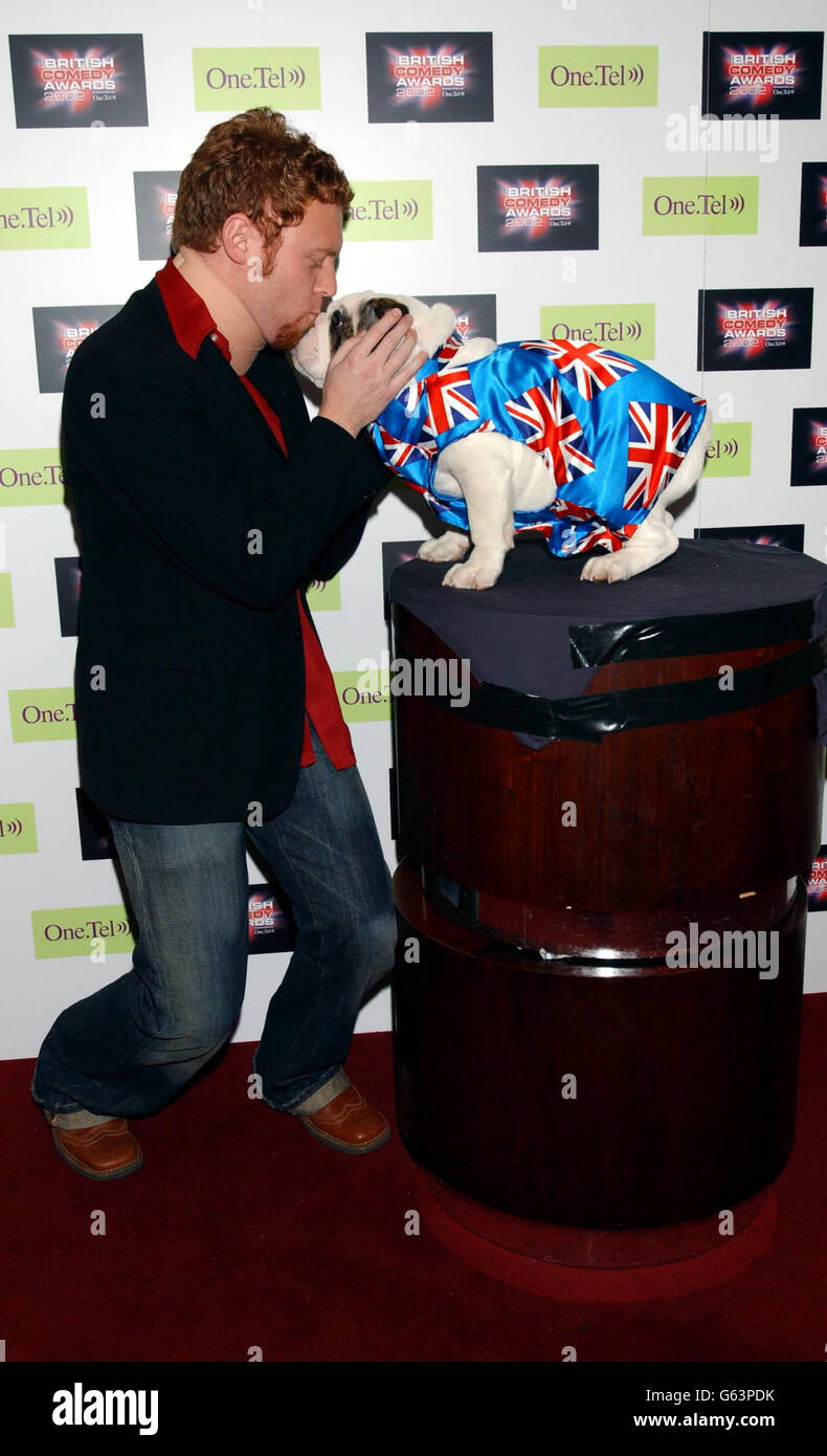 Channel 4's Bo Selecta star Avid Merrion with a pedigree British bulldog Albert, at the launch party for The British Comedy Awards, at Sway in Covent Garden. Stock Photo