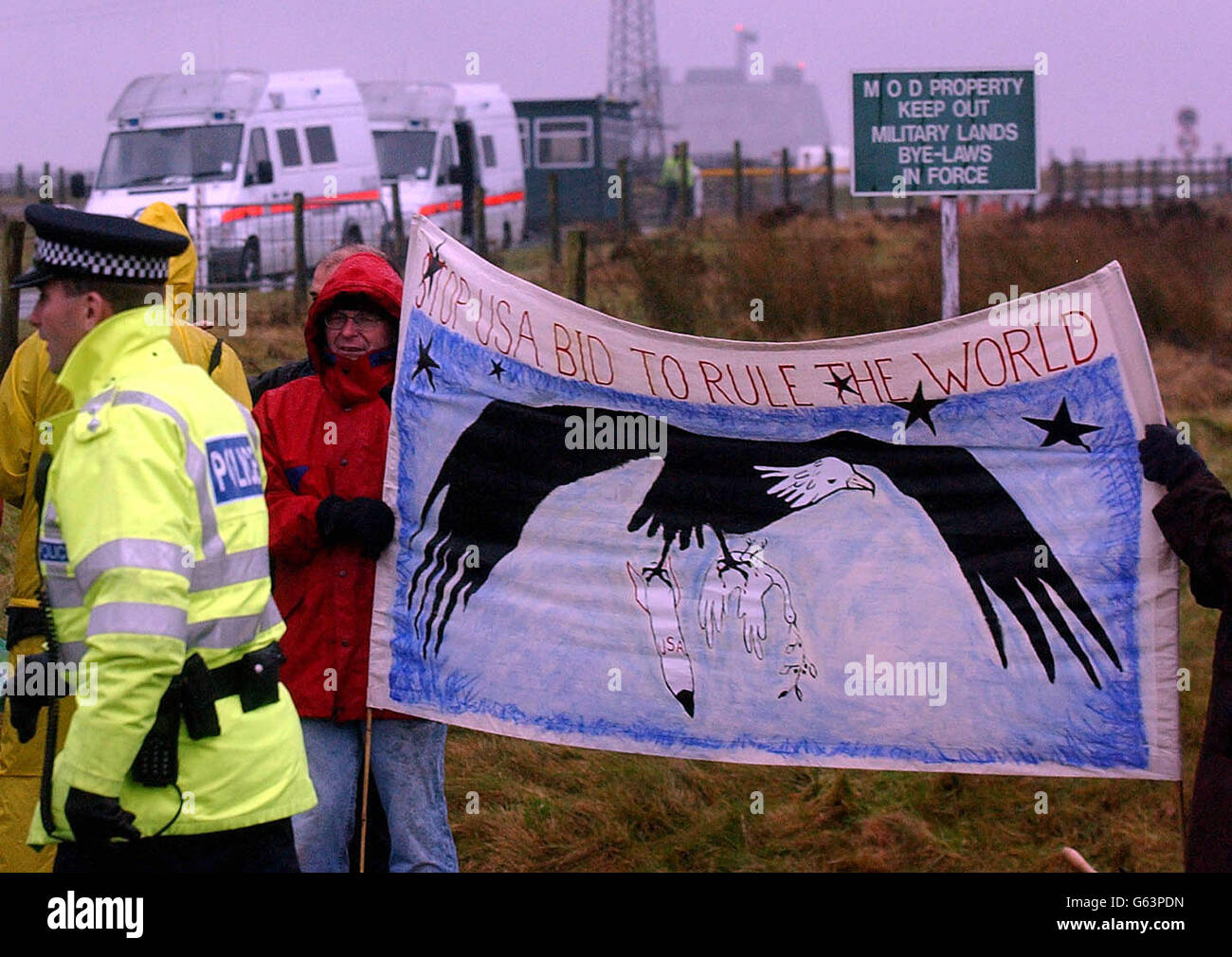 CND protestors at the RAF Fylingdales Base on the North York Moors, where American Lt General Kadish was visiting. The protest is being held because CND campaigners think the base is being used for the controversial Star Wars program. * Despite the freezing cold conditions and torrential rain over 30 demonstrators wrapped up in waterproofs and thermals made their views clear by waving banners, props and placards. One stated: "US Space Command, Killers, Cowards, Criminal Creeps, Hands Off Flyingdale." Stock Photo