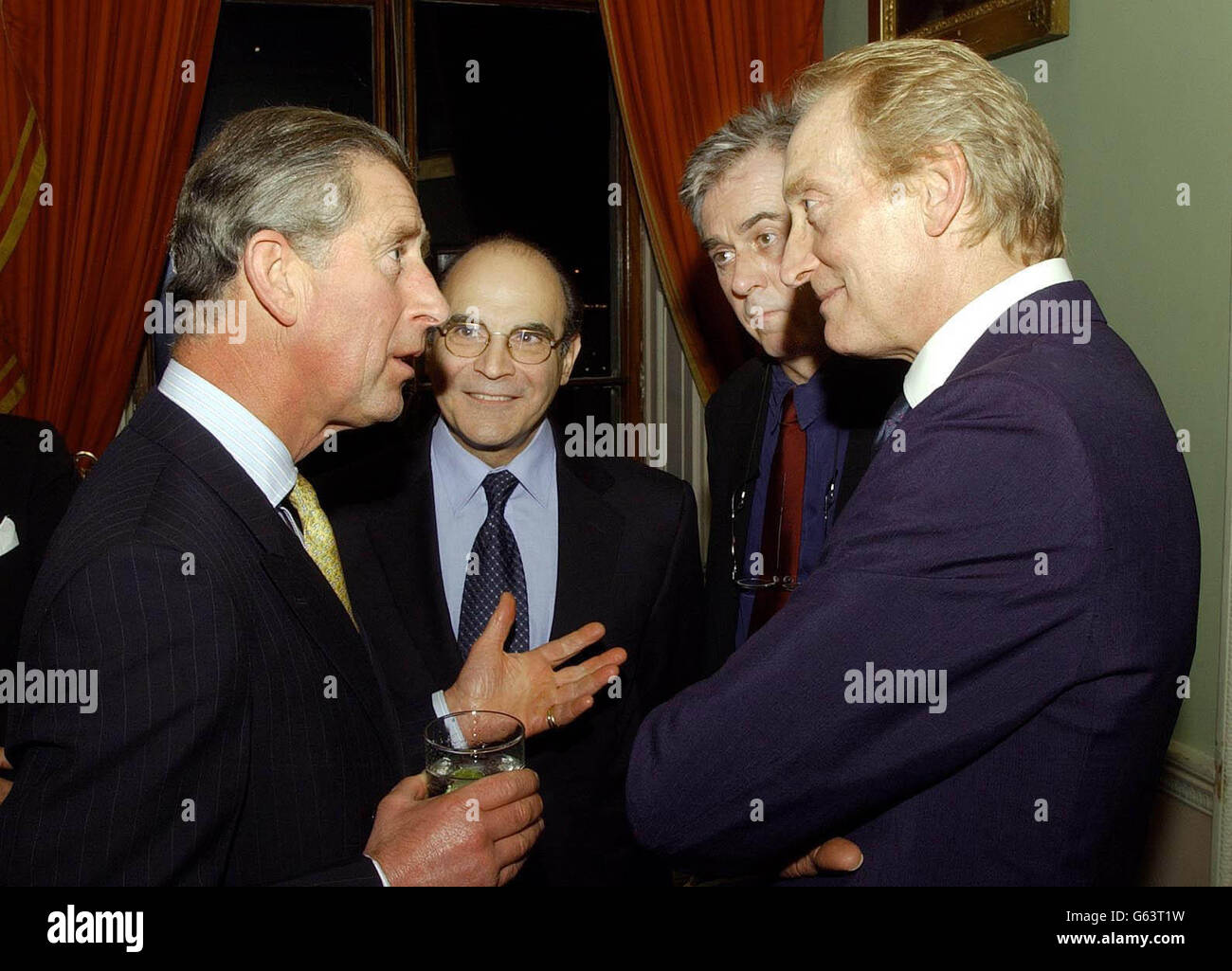 The Prince of Wales talks with actor Charles Dance (right), as David Suchet (second left) and Nicholas Le Prevost listen in, during a reception for Actors of the Royal Shakespeare Company of which the Prince is president, at Home House, cantral London. Stock Photo