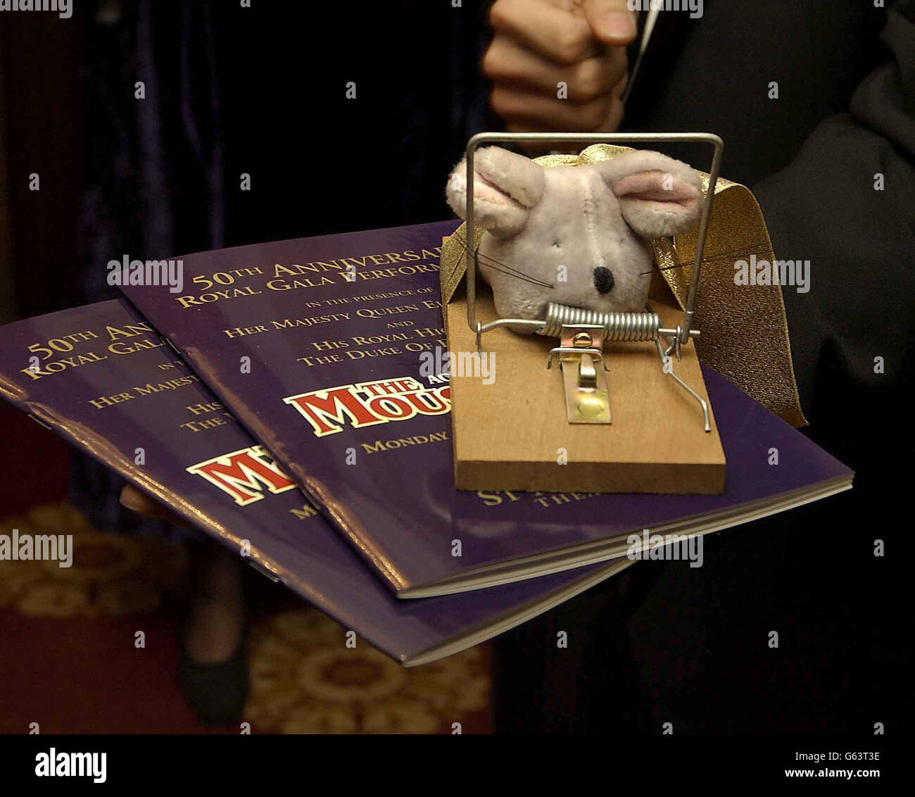 The programme and mousetrap presented to Britain's Queen Elizabeth II at the 50th anniversary of the world's longest-running play, The Mousetrap, at St Martin's Theatre, London. *..Agatha Christie's famous whodunit , the first stage production to achieve a golden jubilee, opened on November 25, 1952, 10 months after the Queen came to the throne. Stock Photo