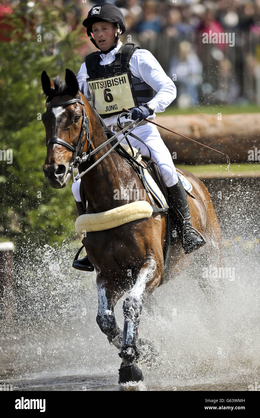 Germany's Michael Jung on Willy Do creates a splash in the lake in the cross-country during day four of the Badminton Horse Trials in Badminton, Gloucestershire. Stock Photo