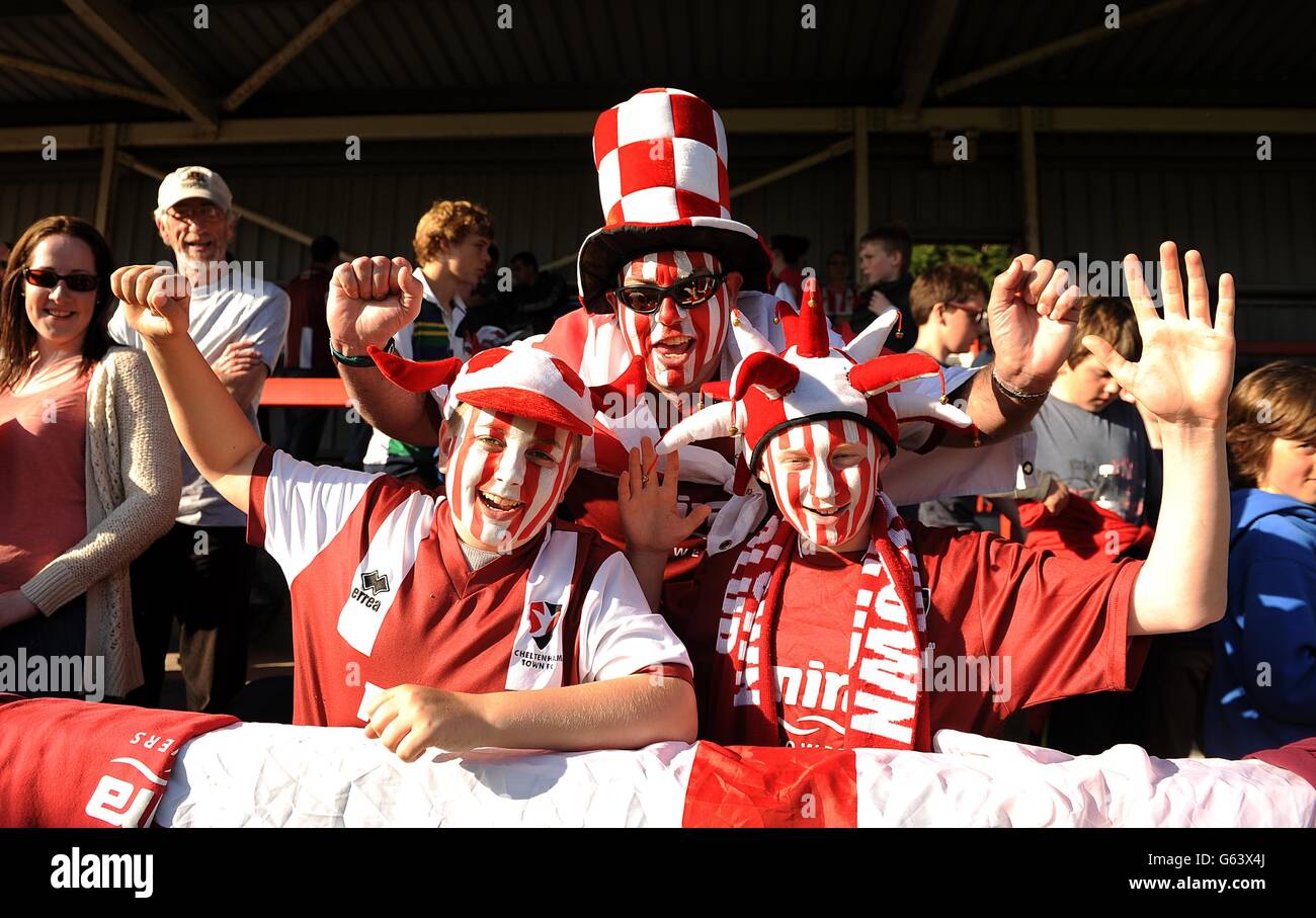 Cheltenham town fans cheer on their side in the stands hires stock