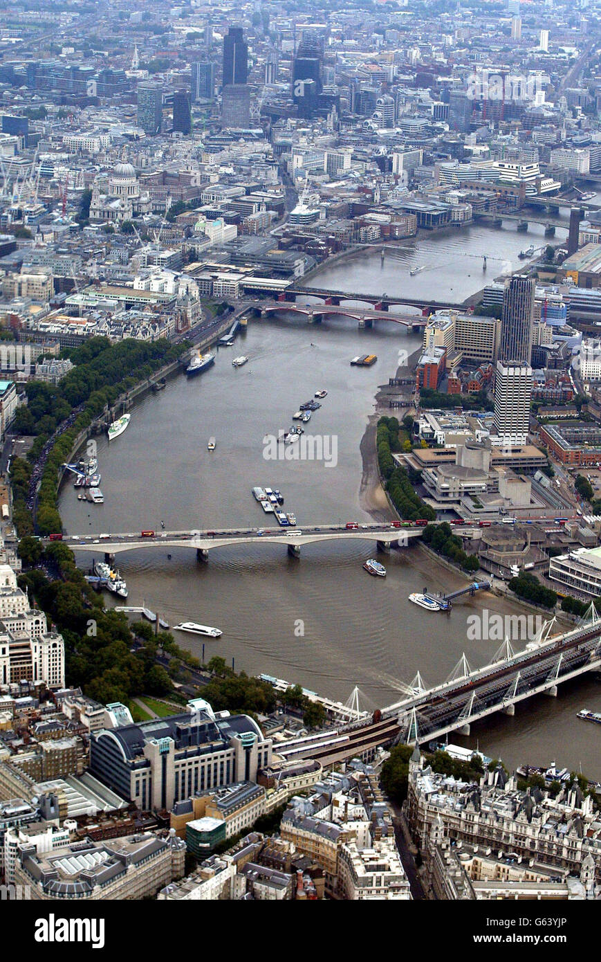 A Canal Narrowboat Making Its Way Inland Up The River Thames Through