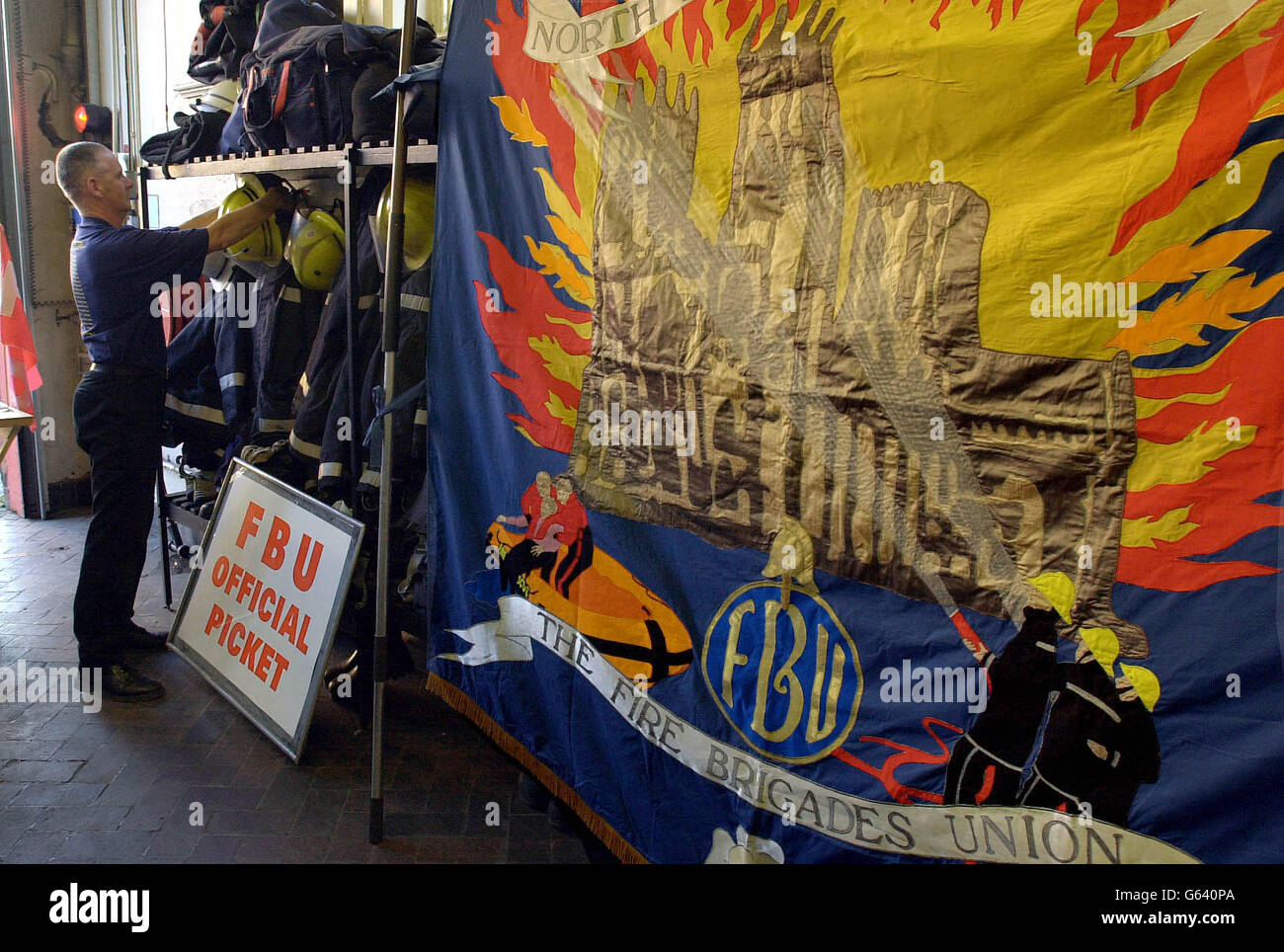 Preparing for the picket line as Firemen finish a shift at York Fire Station, with their barriers and Union Banner waiting to be placed outside their station on the first day of the National Strike. *..The banner depicts the work of fire crews as they saved York Minster from fire and their work in rescuing people from the regular floods in the City. Stock Photo