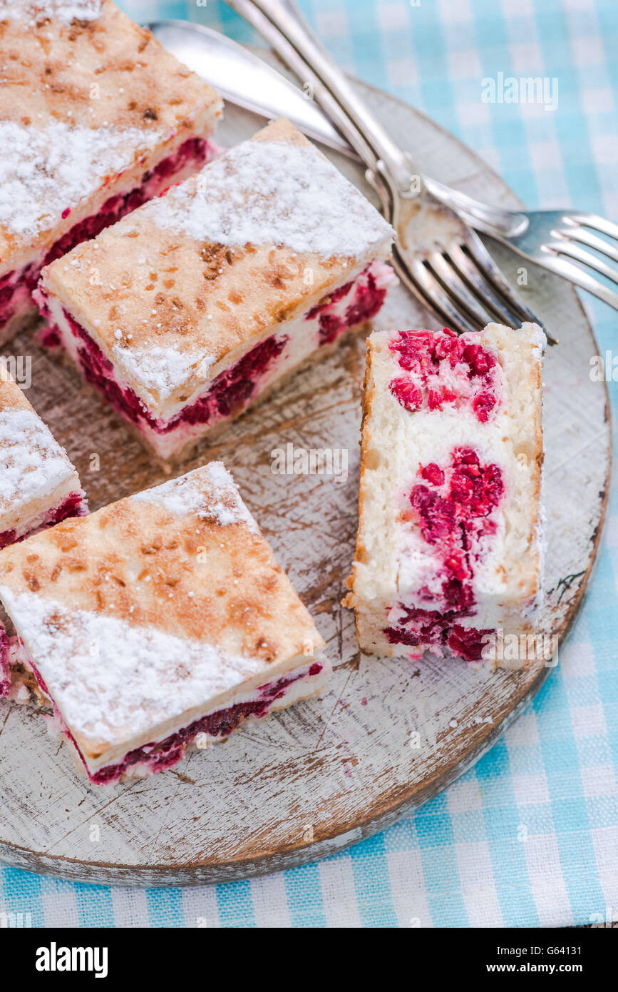 square slice of raspberry semifreddo cake on bright background Stock Photo