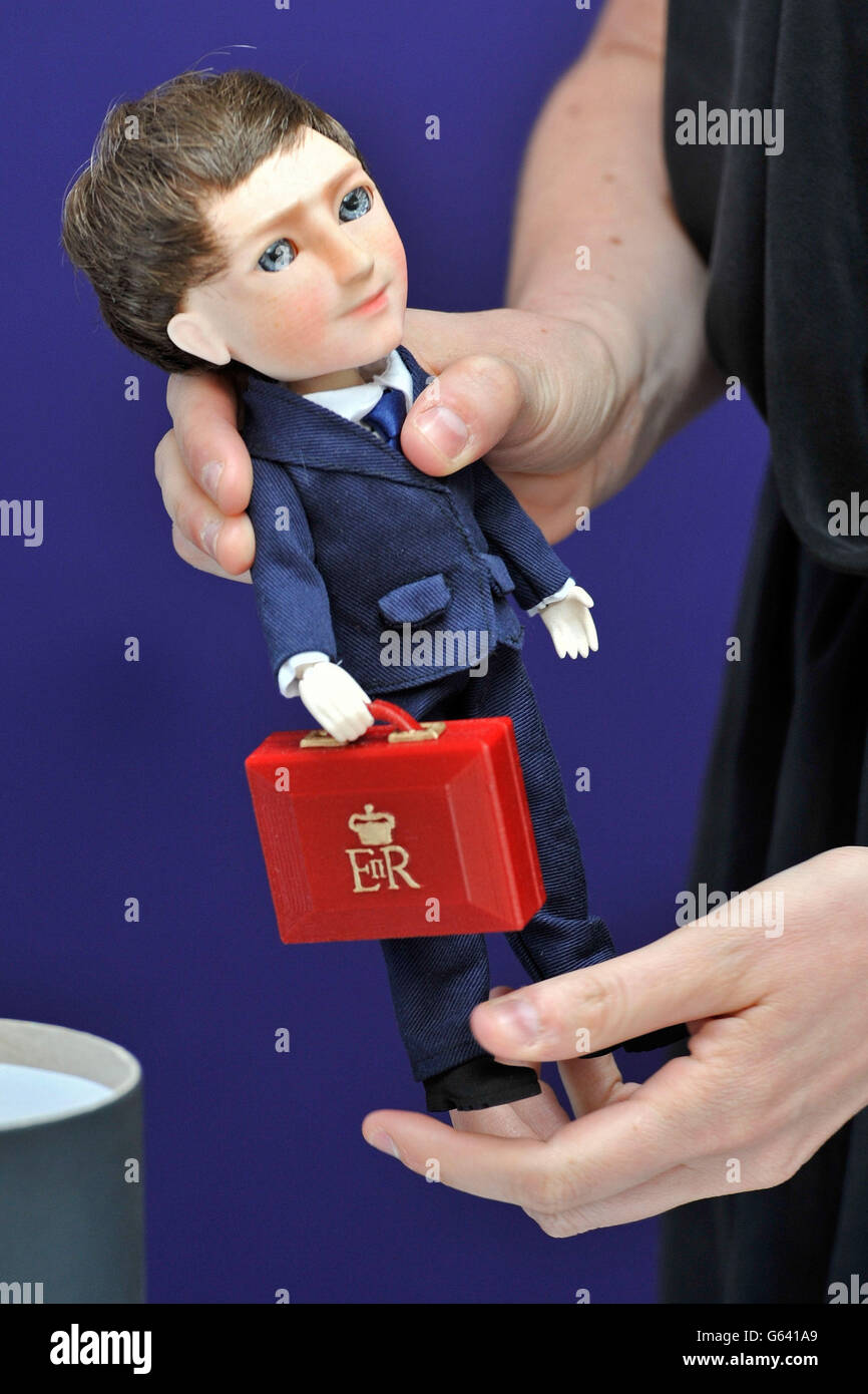 A David Cameron doll as Prince Harry and David Cameron are presented with dolls by 'Makielab' company co-founder Jo Roach of themselves during part of a UK business campaign called 'GREAT' at the Milk Studios, Manhattan, New York. Stock Photo