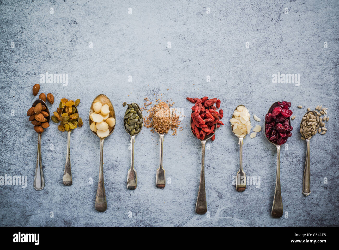 superfood on spoons background, flat lay from above Stock Photo