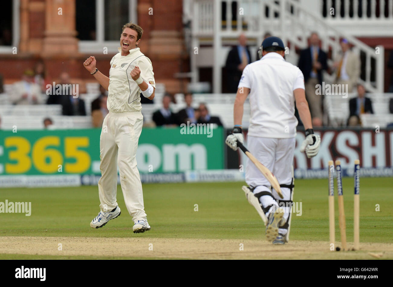 New Zealand's Tim Southee (left) celebrates bowling out England's Johnny Bairstow for 5 during the first test at Lord's Cricket Ground, London. Stock Photo