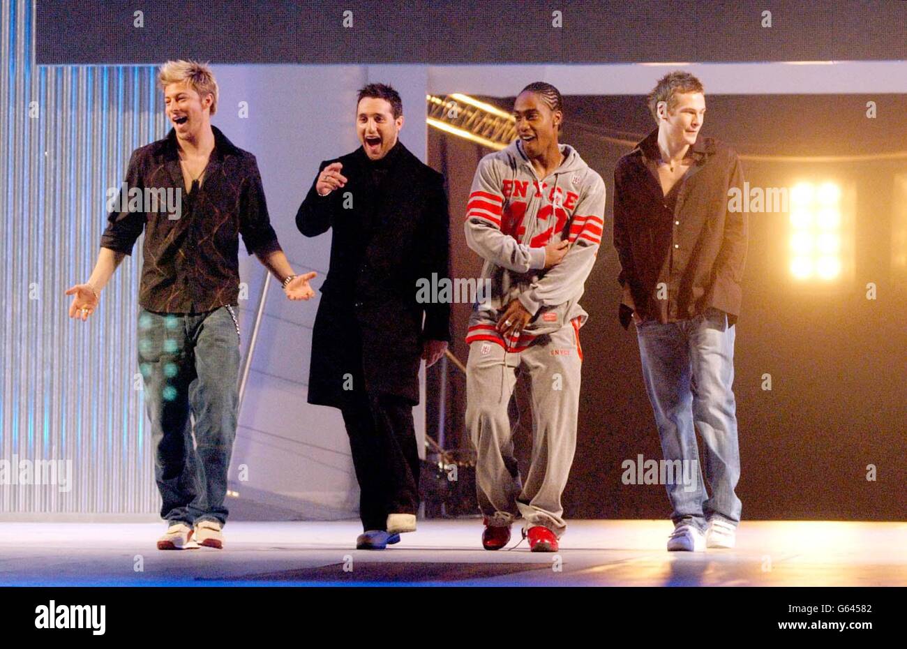 Boy band Blue (from left) Duncan, Anthony, Simon and Lee, model clothes on catwalk during the Clothes Show Live which opens at the NEC Birmingham. Stock Photo