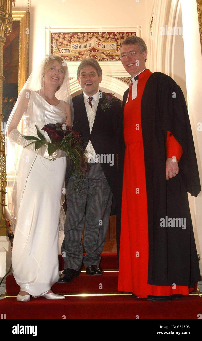 MP for Buckinghamshire John Bercow (centre) and wife Sally Illman with Canon Robert Wright who married them at Westminster in Saint Margarets at the House of Commons in central London. Stock Photo