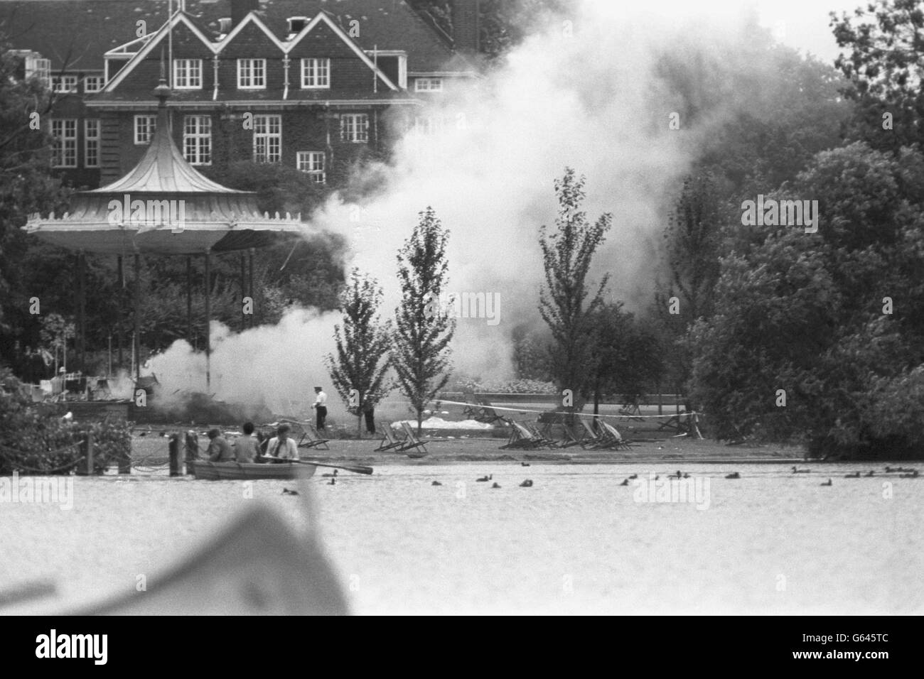 Smoke rises from the wreckage of the Regent's Park bandstand after today's bombing. At least six people were killed in the blast, which happened while the band of the Royal Green Jackets were giving a lunchtime concert. Stock Photo