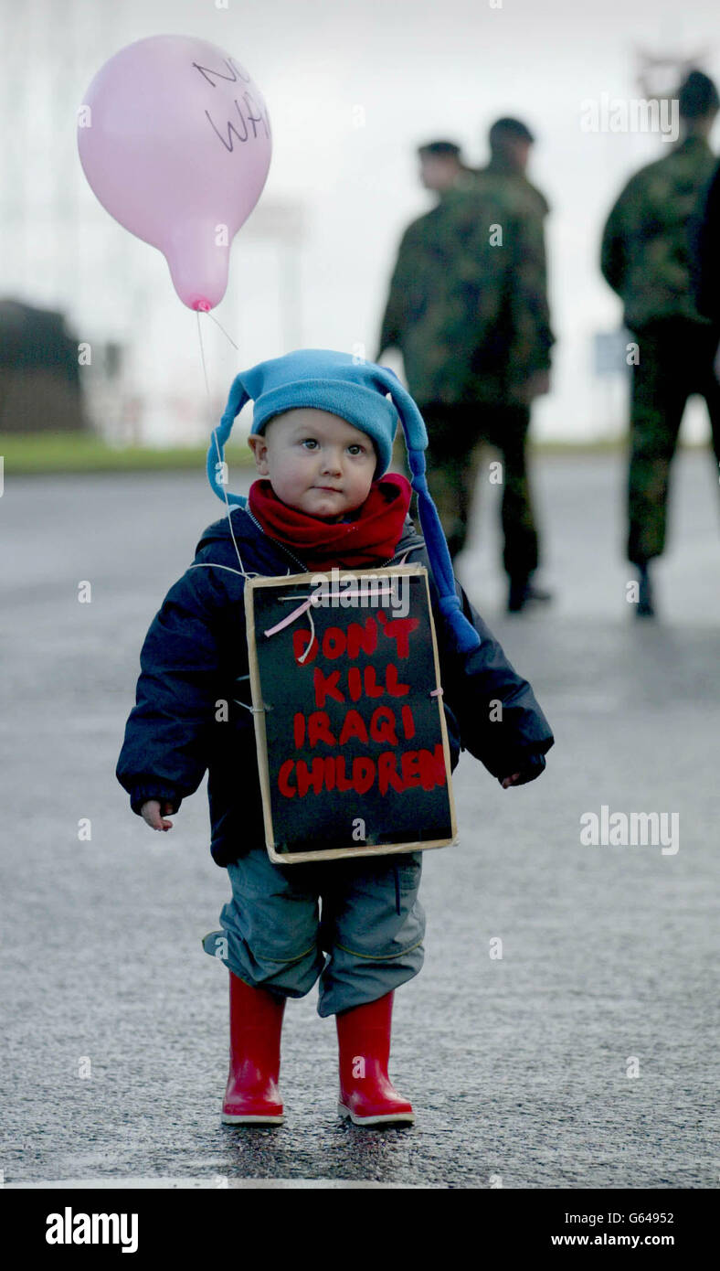 Jordan Vigay, 21 months old, from Portsmouth demonstrates against war with Iraq outside Marchwood Military Port near Southampton. Much of the Army's equipment including trucks and Land Rovers will leave from the port. Stock Photo
