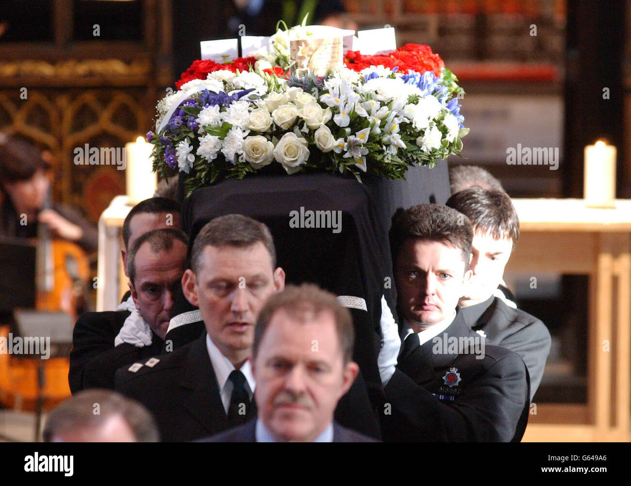 The funeral service of Detective Constable Stephen Oake at Manchester Cathedral. A thousand mourners attended the funeral of the Special Branch police officer stabbed to death in an anti-terrorism raid in Manchester last week. Stock Photo
