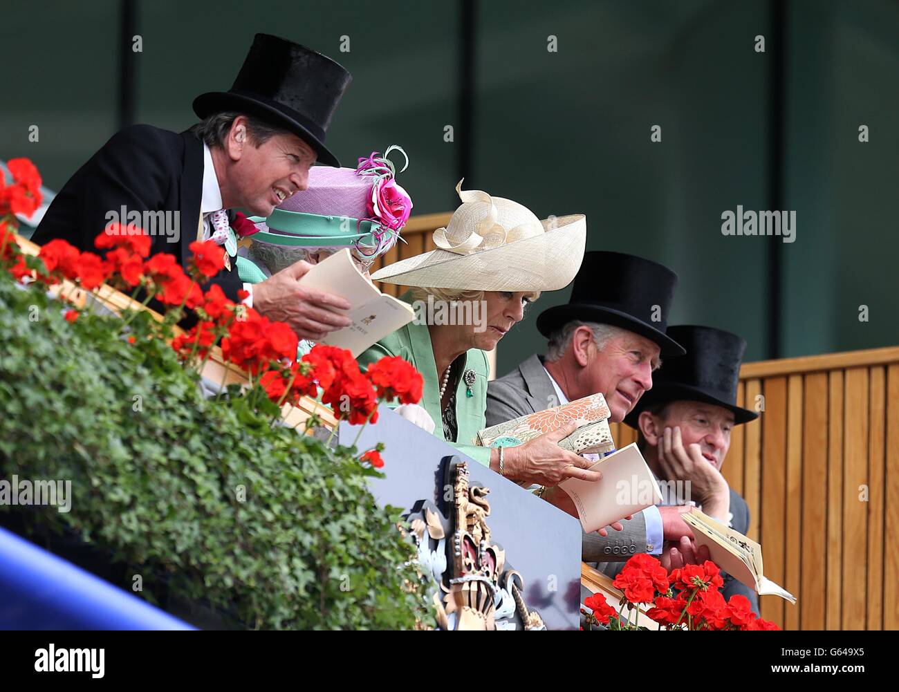 Queen Elizabeth II, Camilla the Duchess of Cornwall and Prince Charles in the royal box during day two of the Royal Ascot meeting at Ascot Racecourse, Berkshire. Stock Photo