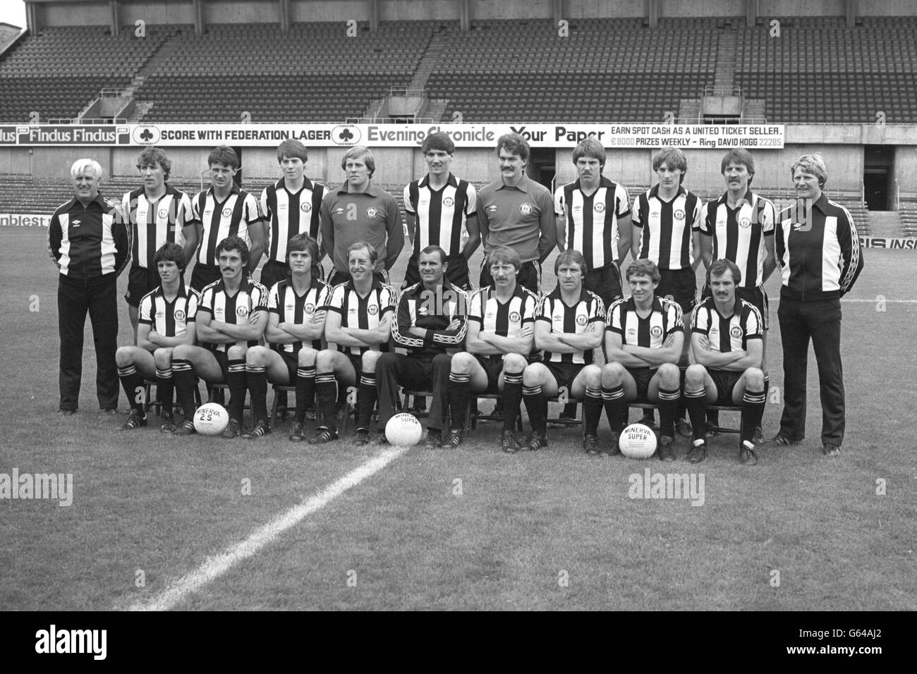 The Second Division Newcastle United squad line up at their St James's Park ground. (Back row, from left) Tommy Cavanagh, Steve Carney, Bruce Halliday, Chris Waddle, Steve Hardwick, Mick Harford, Kevin Carr, David Barton, Peter Haddocks, Bobby Shinton and Ian McFaul. (Seated, from left) Kenny Wharton, John Trewick, Nigel Walker, Mick Martin, manager Arthur Cox, John Brownlie, Alan Shoulder, Peter Johnson and Ian Davies. Stock Photo