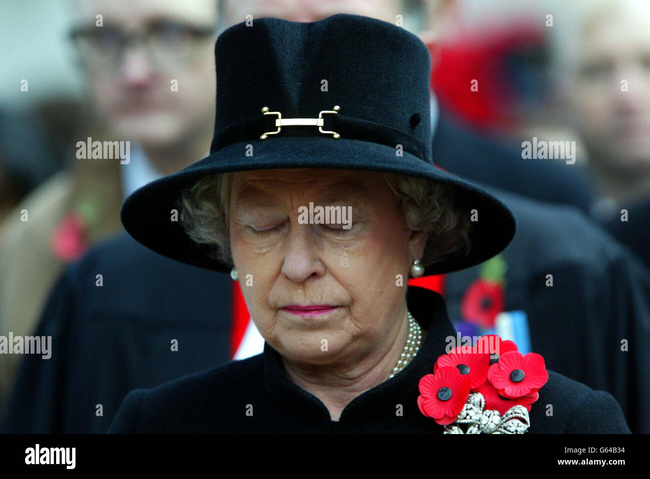 Queen Elizabeth II sheds a tear during the Field of Remembrance Service at Westminster Abbey, London. Stock Photo