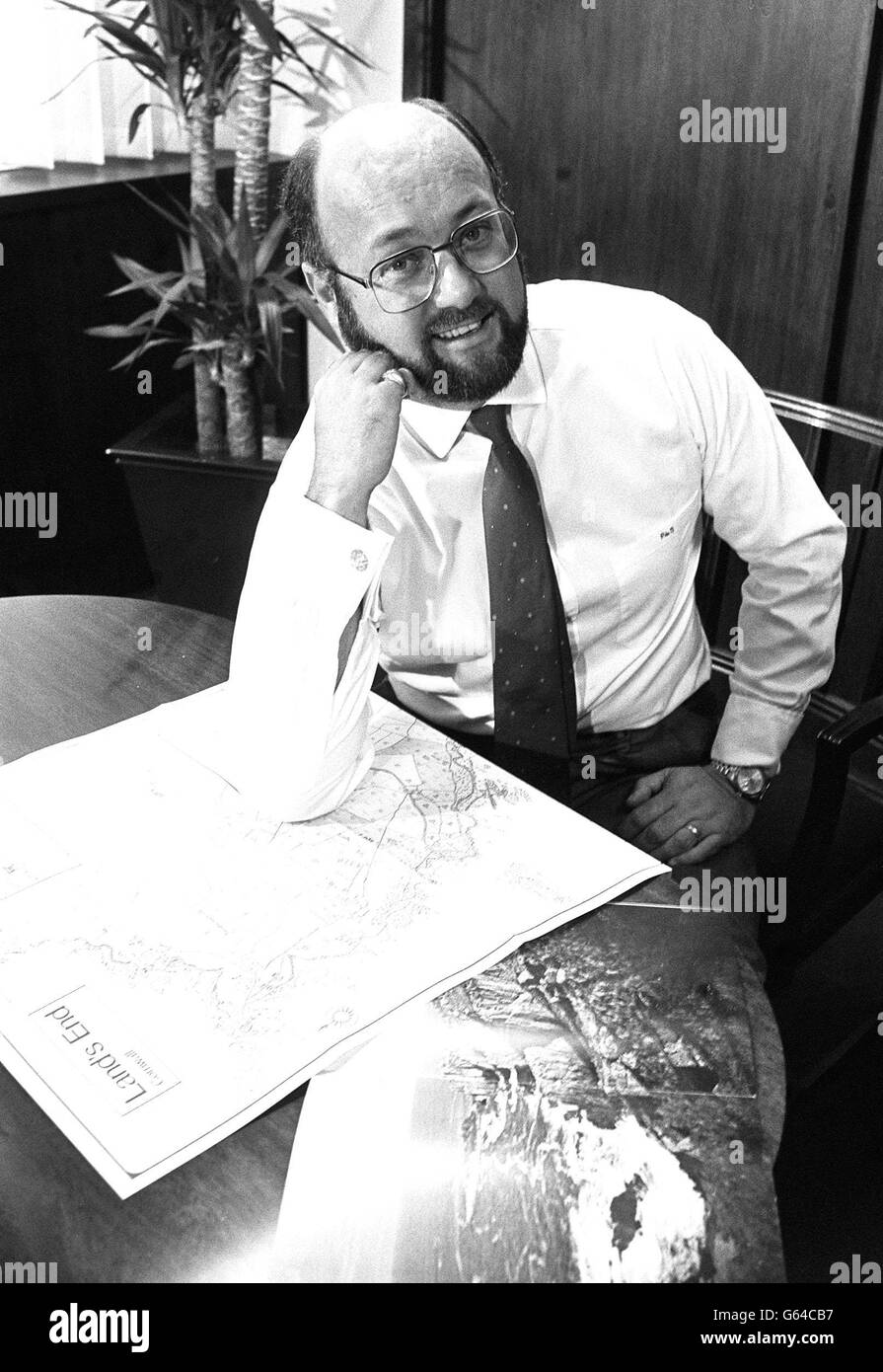 Multi-millionaire businessman Peter De Savary studies a map of Land's End in his Pall Mall office in London, after buying the 105-acre Cornish landmark. Stock Photo