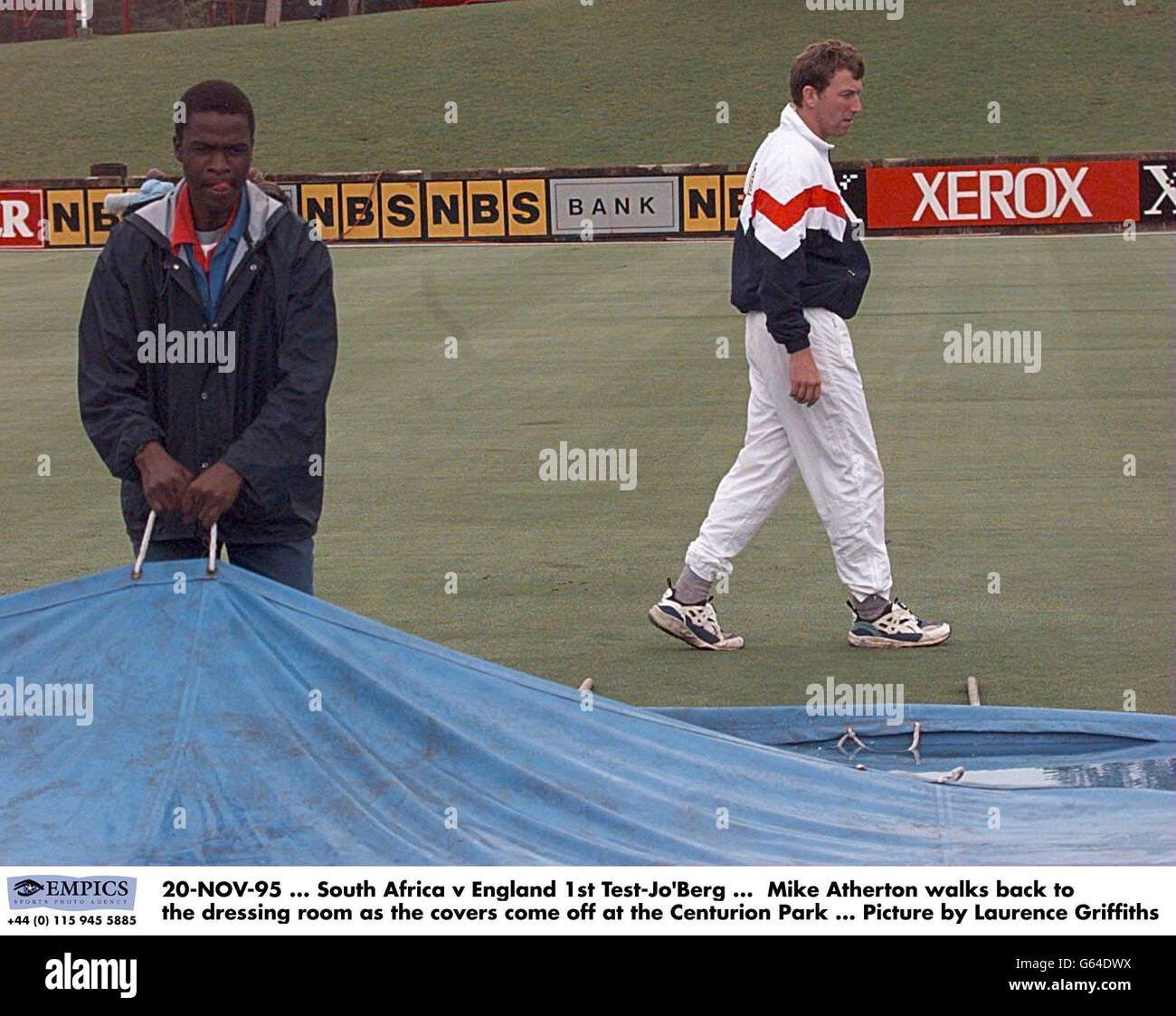 20-NOV-95. South Africa v England 1st Test-Jo'Berg. Mike Atherton walks back to the dressing room as the covers come off at the Centurion Park. Picture by Laurence Griffiths Stock Photo
