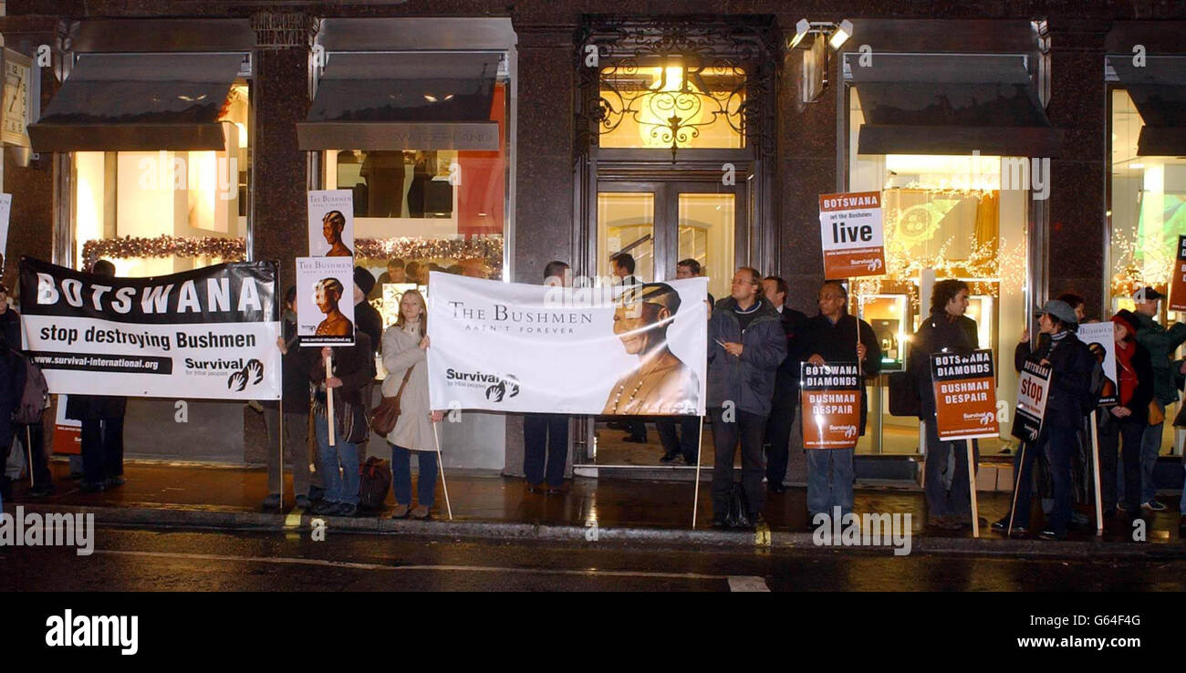 Protesters outside the new DeBeers Diamond Store on Old Bond Street, London, which is being launched. They are objecting to the alleged treatment by the company of the Bushmen of Botswana. Stock Photo