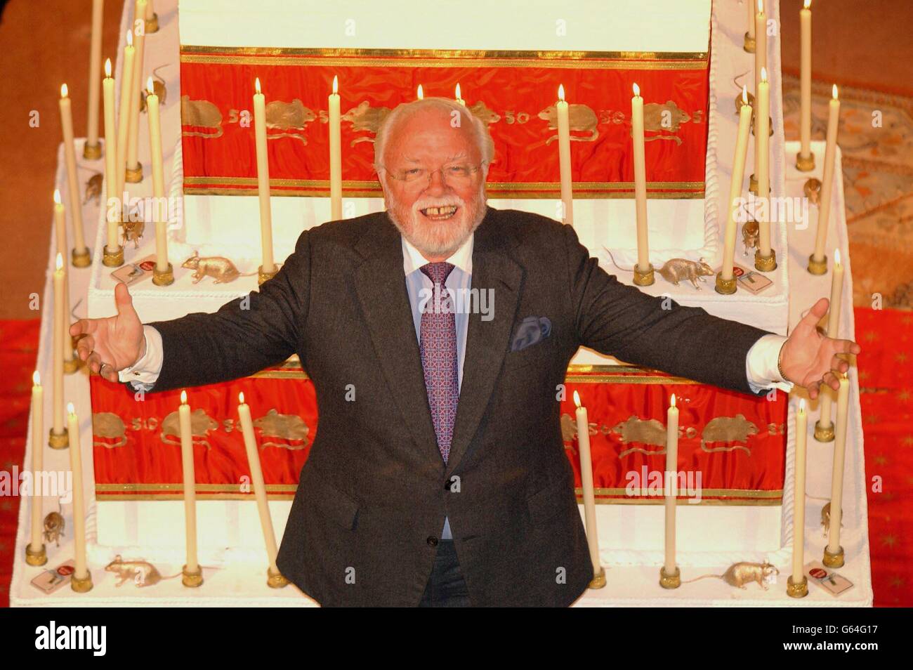 Lord Attenborough with an over-sized cake on the stage at St Martin's Theatre in London helps celebrate the record-breaking 50th anniversary of Agatha Christie's, The Mousetrap. *..Sir Richard, who starred in the original production of the Mousetrap in 1952 is launching the 50th celebrations of the world's longest running play. Stock Photo