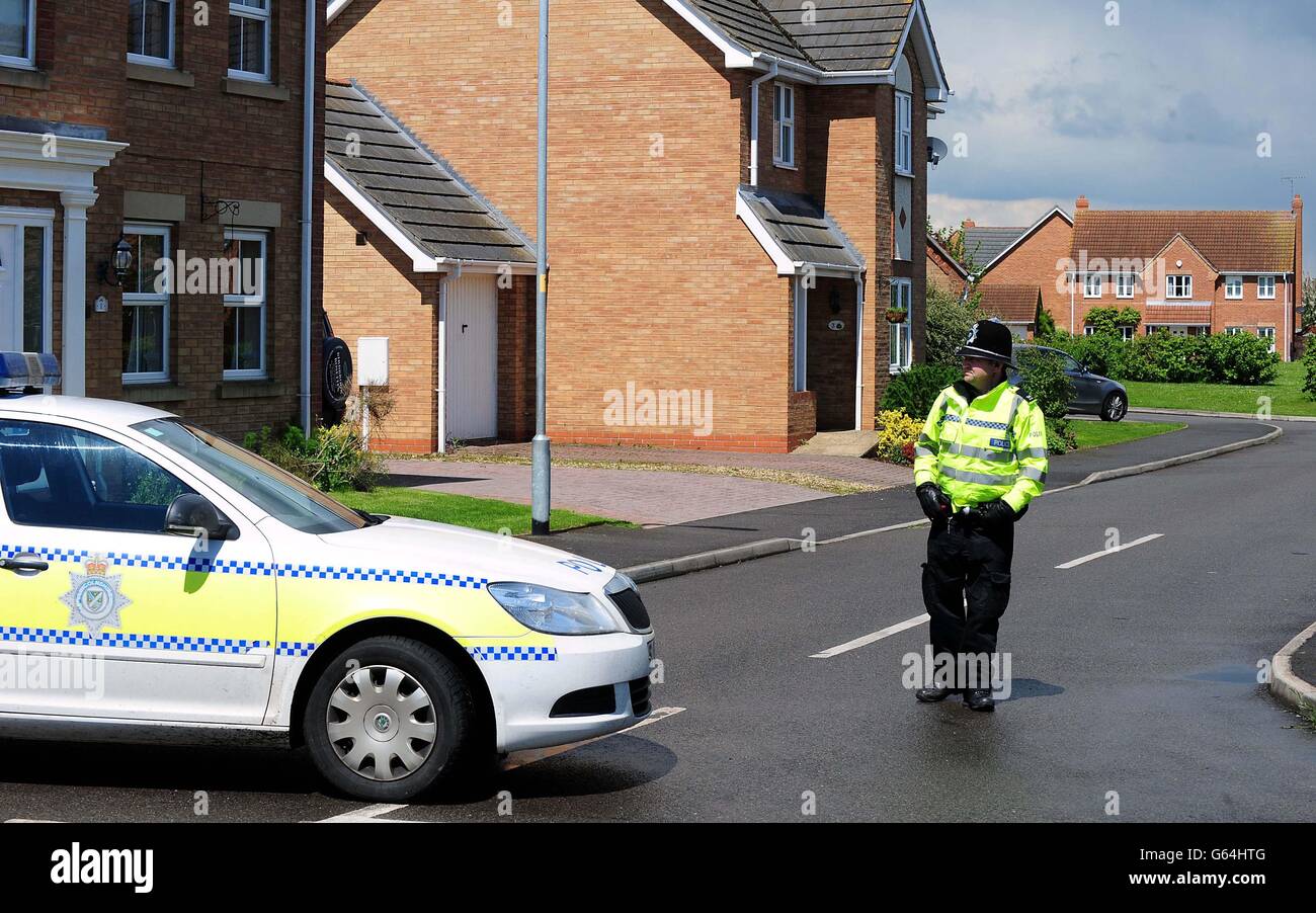 Police close a road in Saxilby, Lincolnshire leading to a house which was raided in connection with the attack in Woolwich, London. Stock Photo